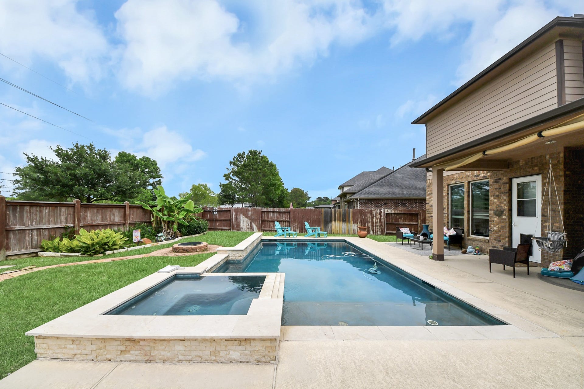 14926 Dogwood View Lane, Cypress, TX 77429 Relax in your private backyard oasis including a pool, spa, outdoor kitchen and plenty of seating to sunbathe of host your loved ones!