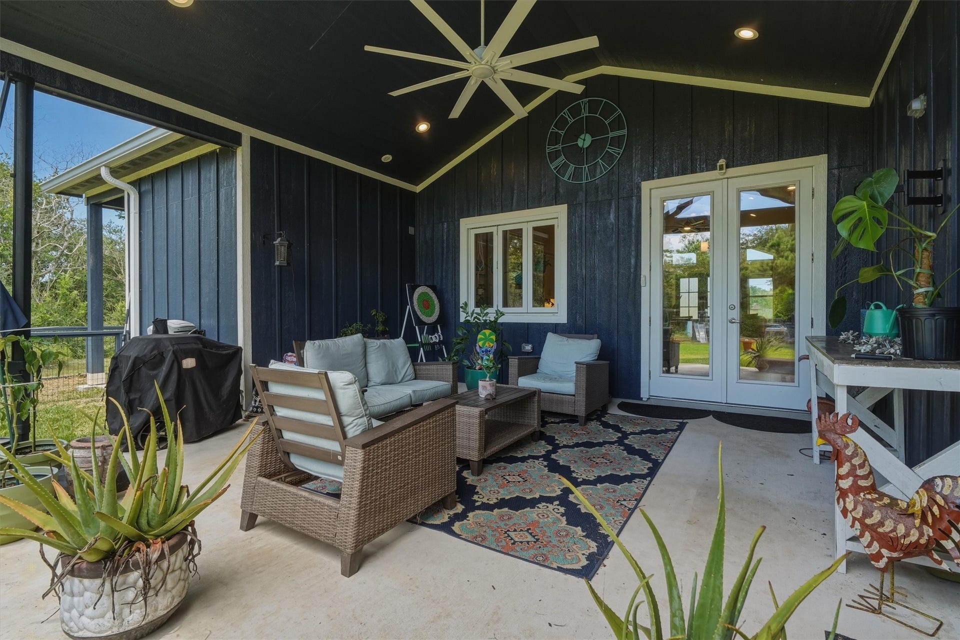 6115 San Leon Drive, Dickinson, TX 77539 Beautiful covered back patio with large fan to beat the Texas Heat! Accordion windows between kitchen and patio.