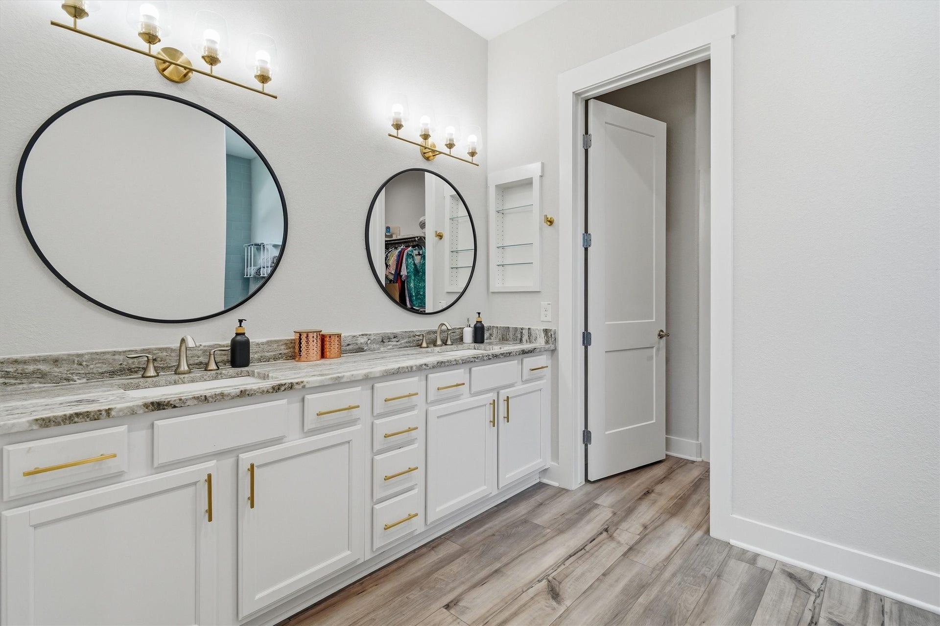 6115 San Leon Drive, Dickinson, TX 77539 Primary en suite featuring double sinks, framed mirrors and tons of storage