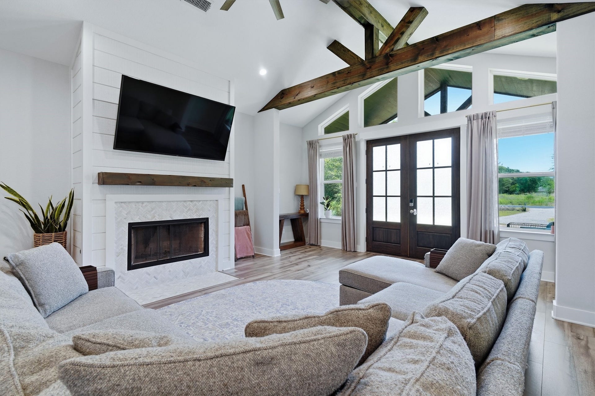 6115 San Leon Drive, Dickinson, TX 77539 Beautiful fireplace, wood beam mantle. Texas sized windows letting in a ton of natual light!