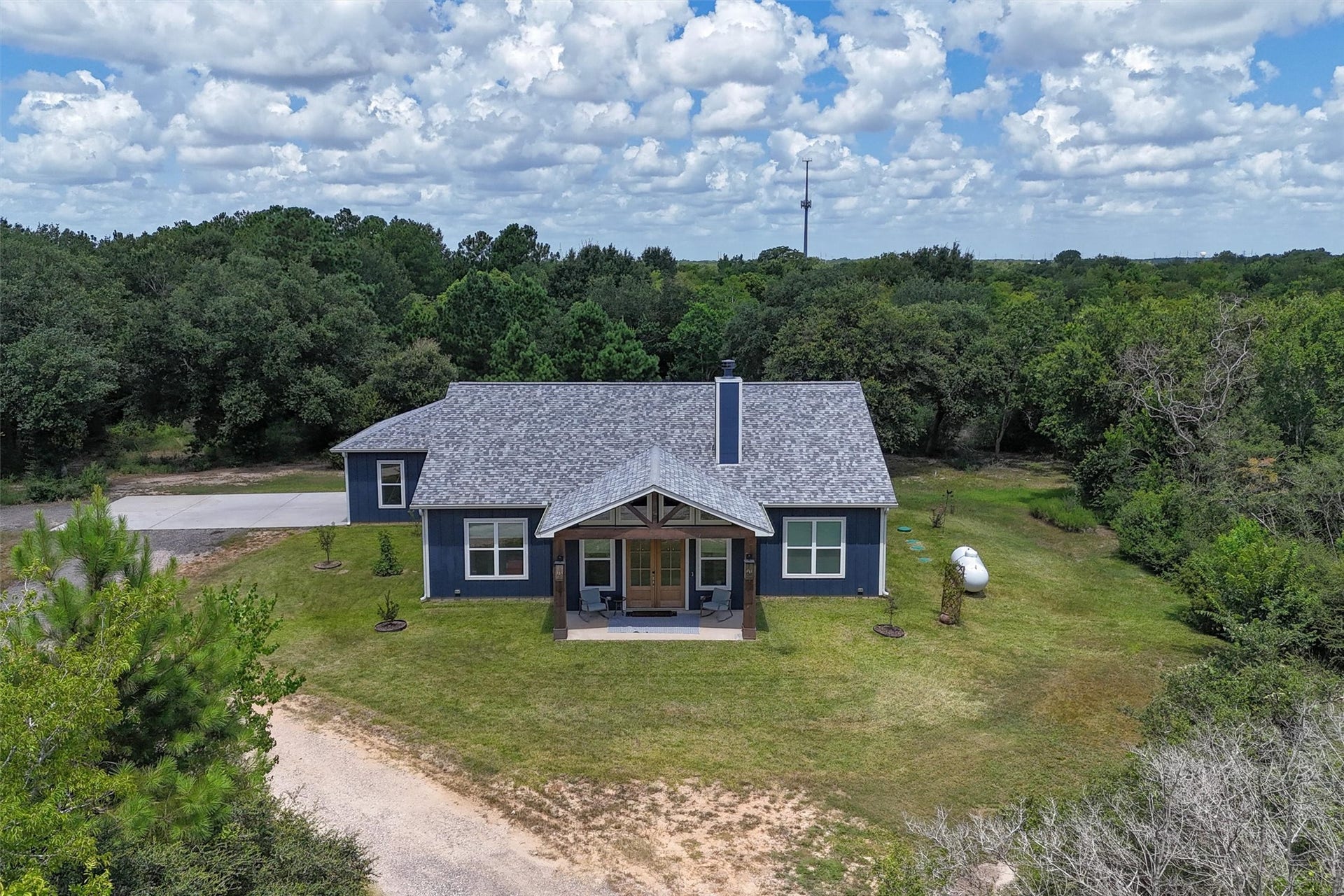 6115 San Leon Drive, Dickinson, TX 77539 3/2/2 custom built in 2024, on 2 acres, complete with circle drive and RV hook up!