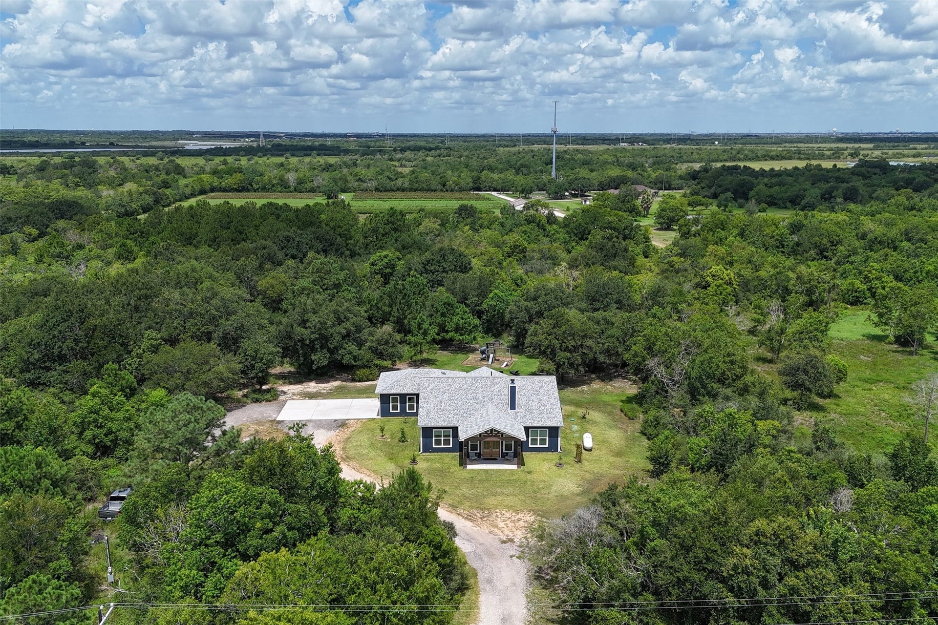 6115 San Leon Drive, Dickinson, TX 77539 Overhead view of the front of the home. Primary backs up to an orchard.