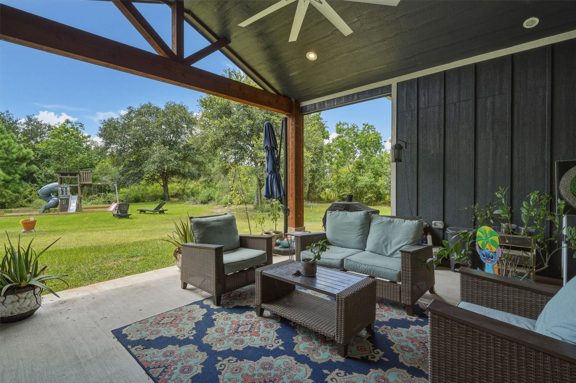 6115 San Leon Drive, Dickinson, TX 77539 3/2/2 custom built in 2024, on 2 acres, complete with circle drive and RV hook up! Beautiful covered patio with large fan to beat the Texas Heat! Overlooking 2 acres of land!
