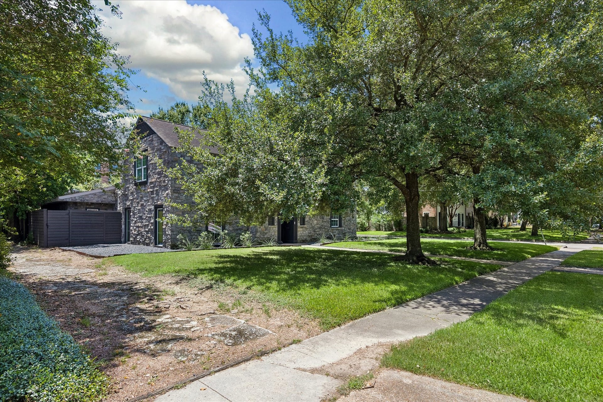 3071 Locke Lane, Houston, TX 77019 Inviting front approach with expansive lawn and timeless curb appeal.