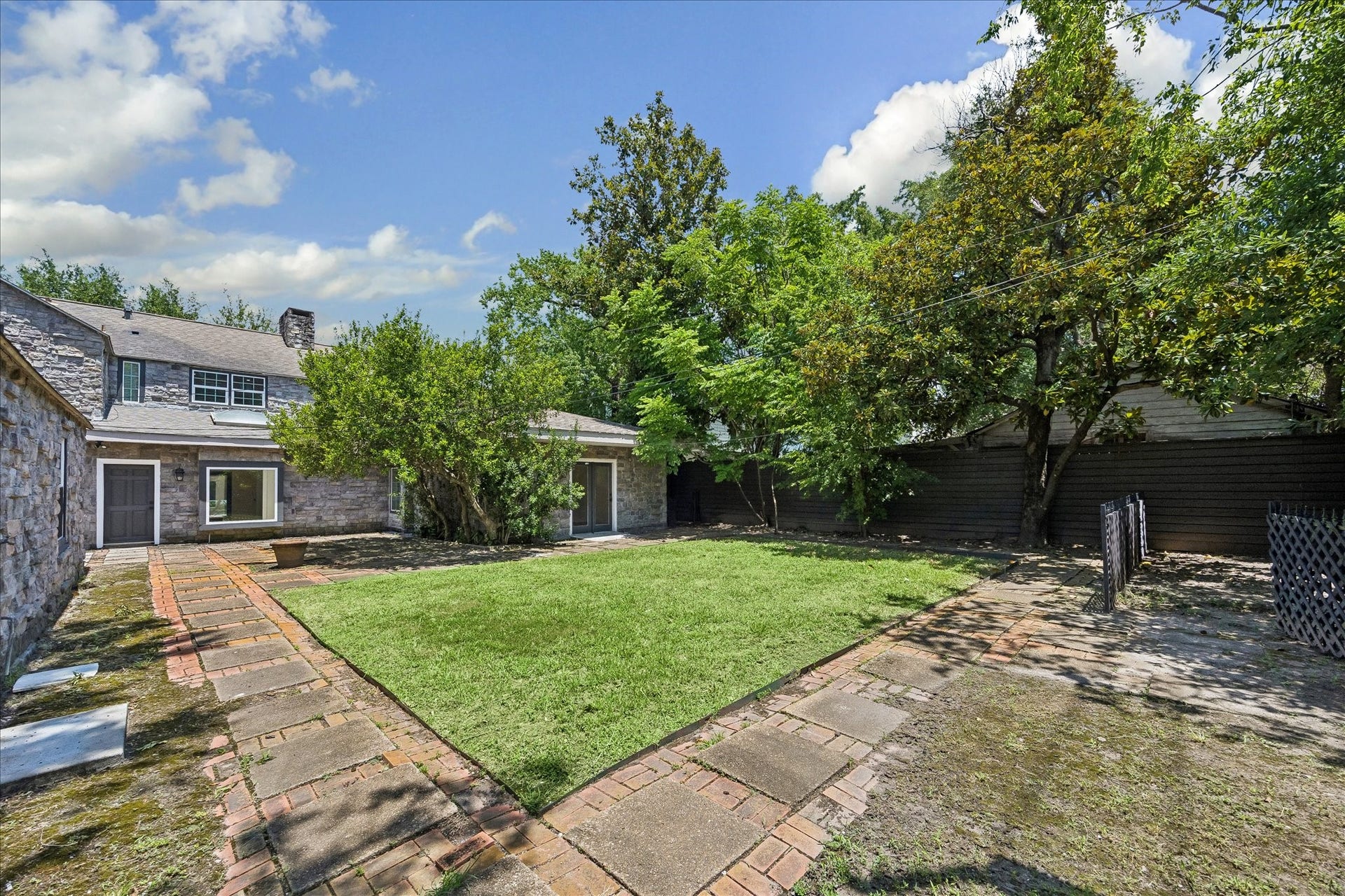 3071 Locke Lane, Houston, TX 77019 Rear backyard with spacious backyard and outdoor entertaining area.