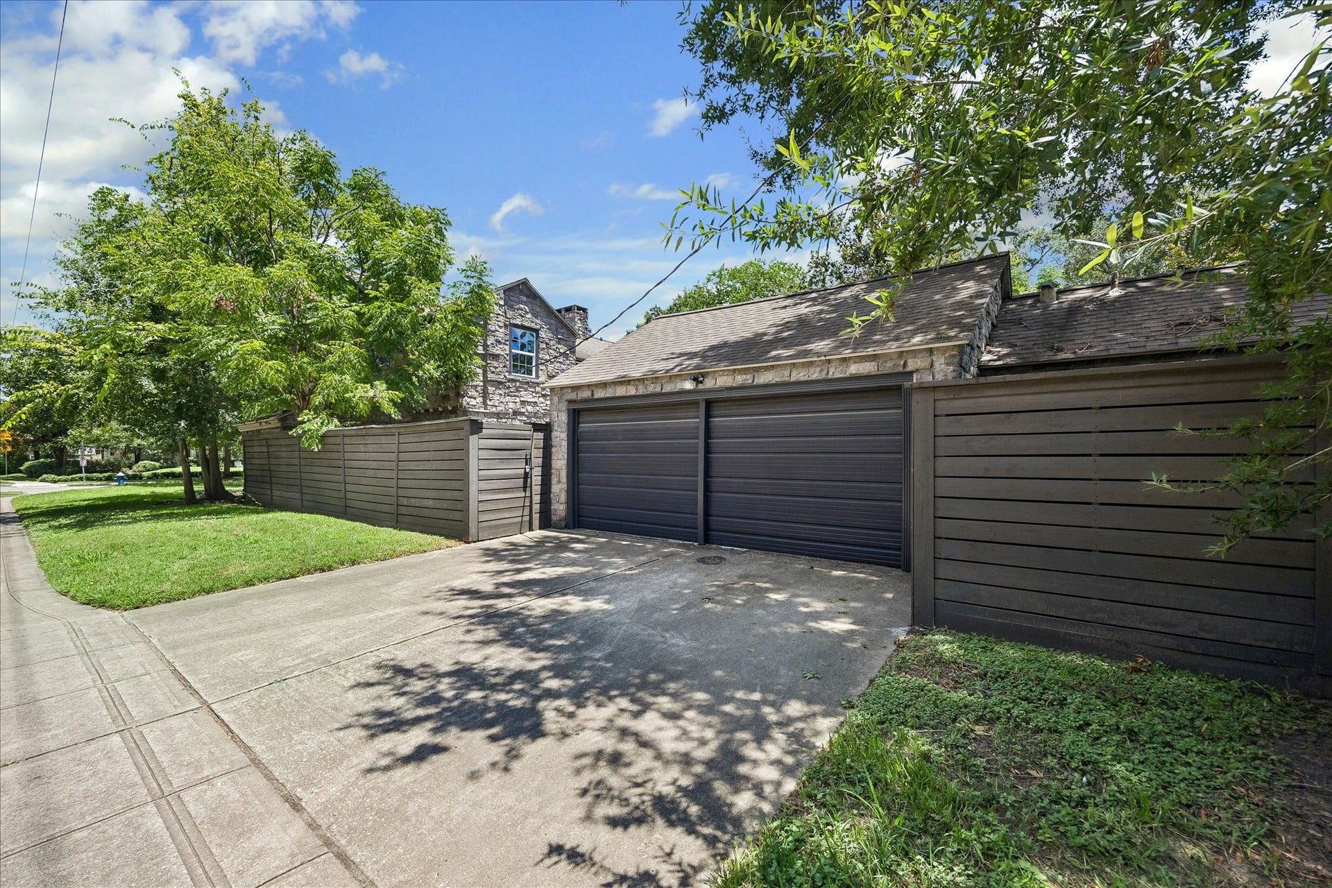 3071 Locke Lane, Houston, TX 77019 driveway leading to Detached garage with additional parking.