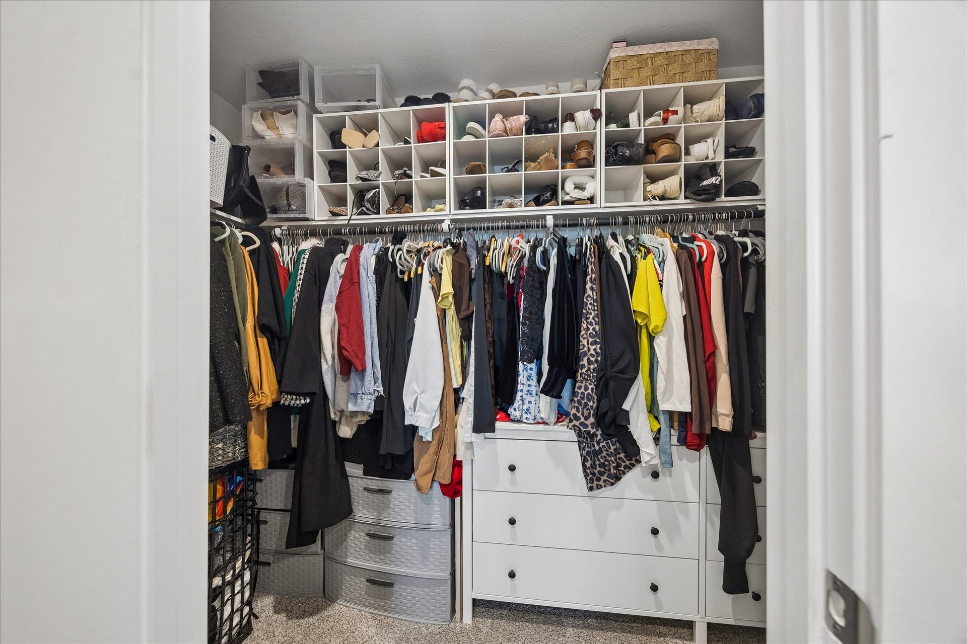 3034 Crown Gate Drive, Houston, TX 77047 Large walk-in primary closet with generous shelving and hanging space for organized storage.
