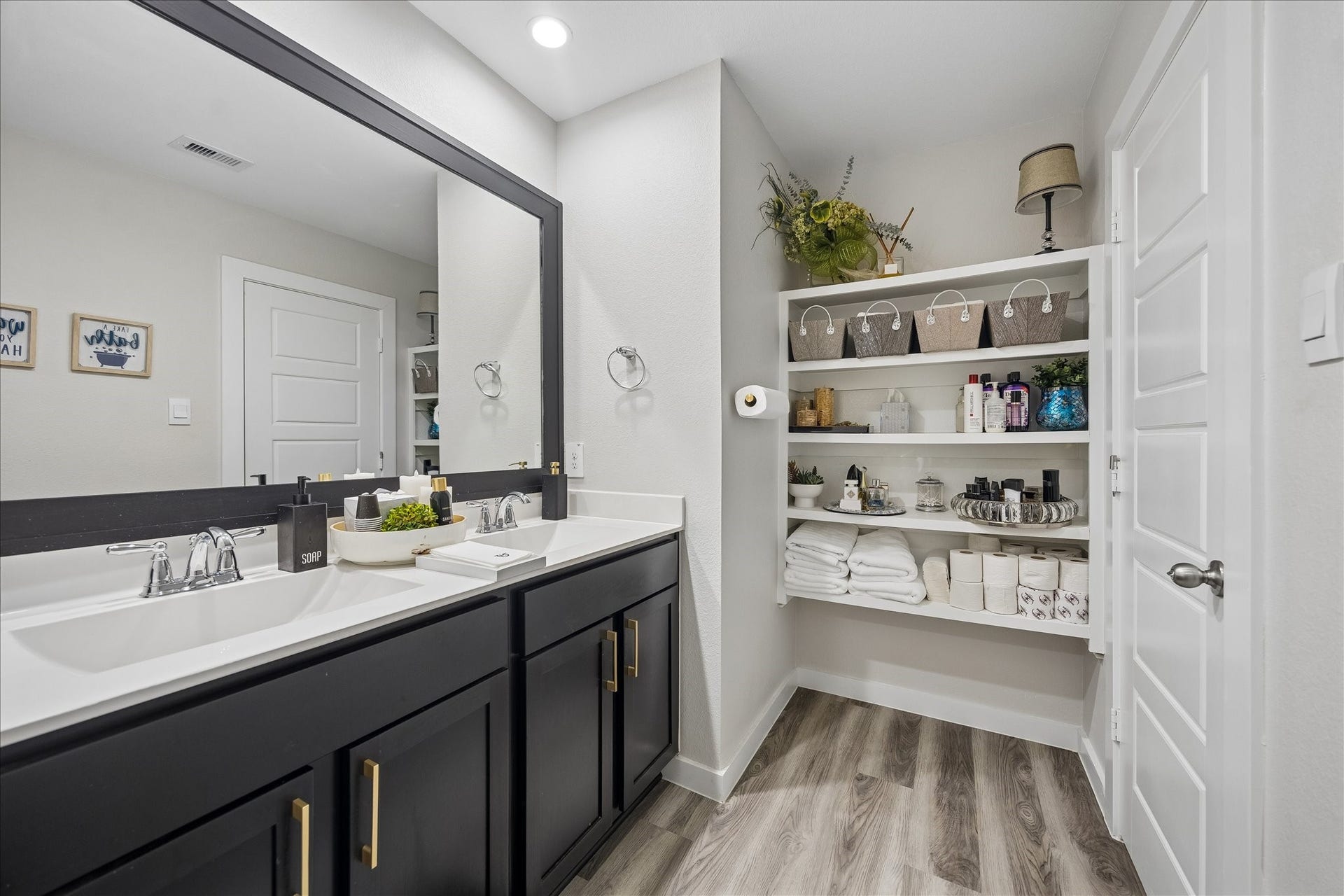 3034 Crown Gate Drive, Houston, TX 77047 Additional view showcasing the vanity, storage and convenient built-in shelving.