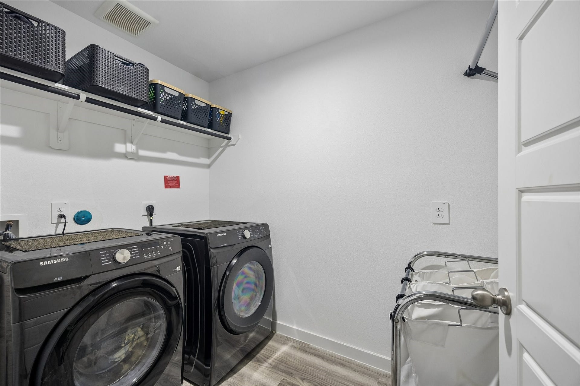 3034 Crown Gate Drive, Houston, TX 77047 Dedicated laundry room with space for full-size washer and dryer plus additional storage.