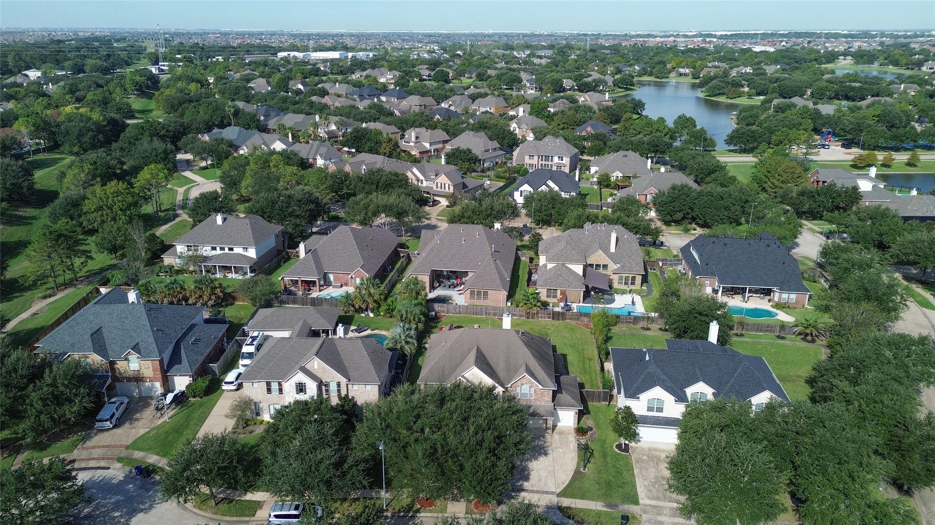 2006 Linden Cove Court, Katy, TX 77494 Charming neighborhood with spacious homes, lush greenery, and nearby water views, offering a serene and picturesque setting.