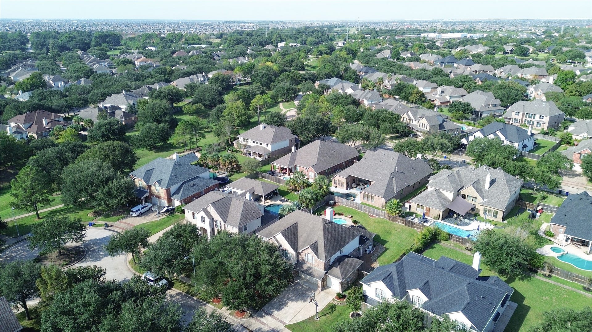2006 Linden Cove Court, Katy, TX 77494 Nestled in a lush, tree-lined neighborhood, this community features spacious homes with private pools, offering a serene suburban lifestyle just a short drive from urban conveniences.