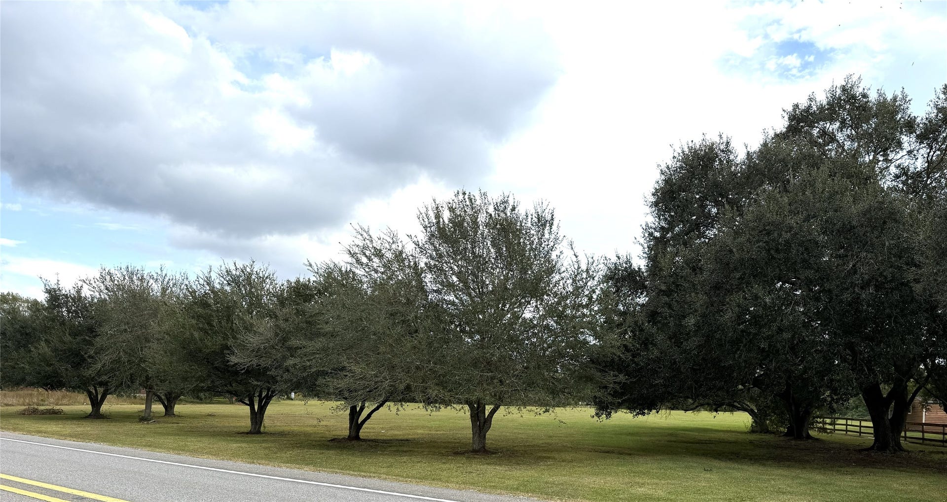 6315 Main Street, Hitchcock, TX 77563 Beautiful oak trees line the front and partially up the side