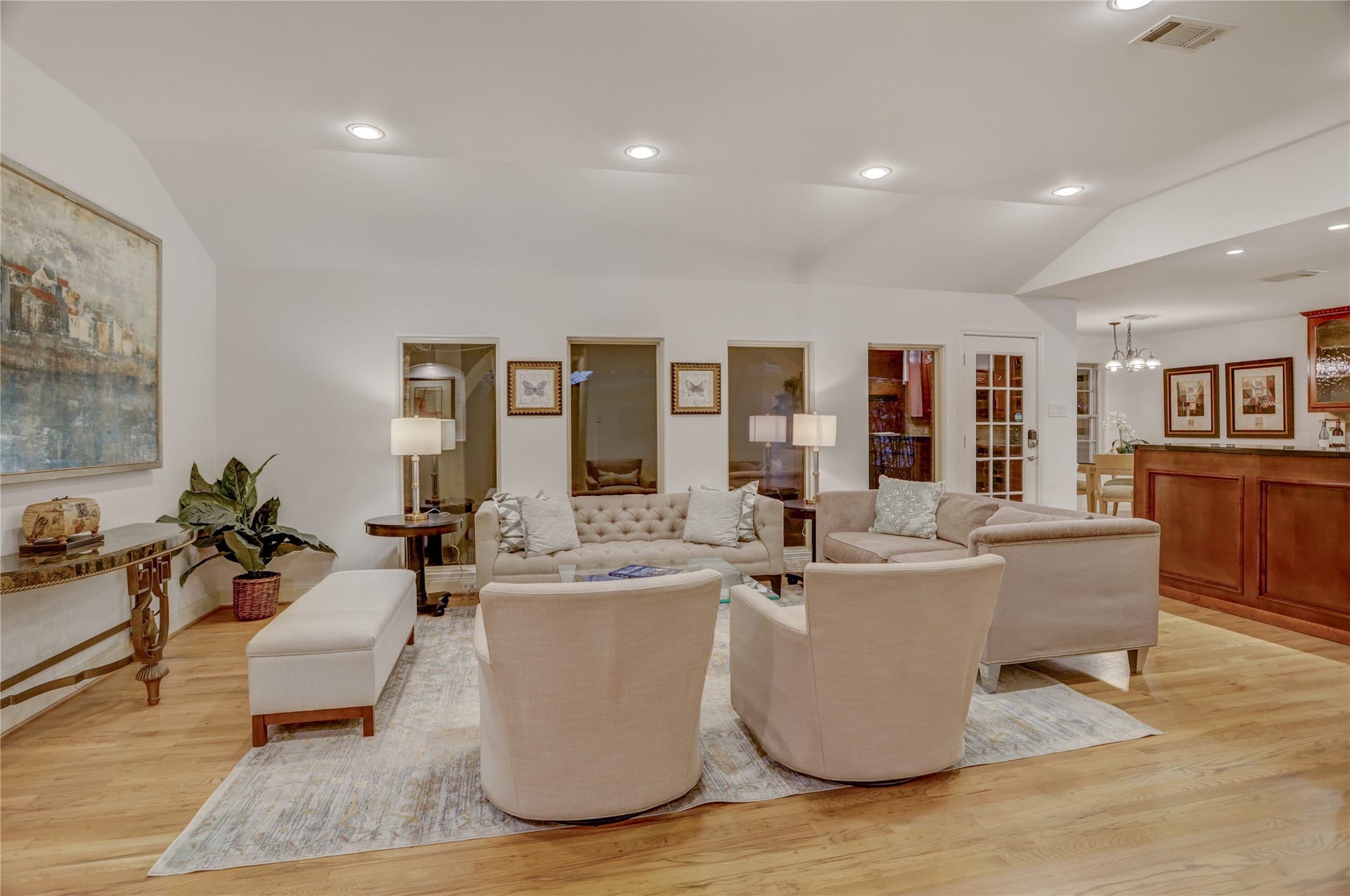 4311 Mcdermed Drive, Houston, TX 77035 The main living area with raised ceilings, LED recessed lighting, and beautiful, custom stained hardwood floors.