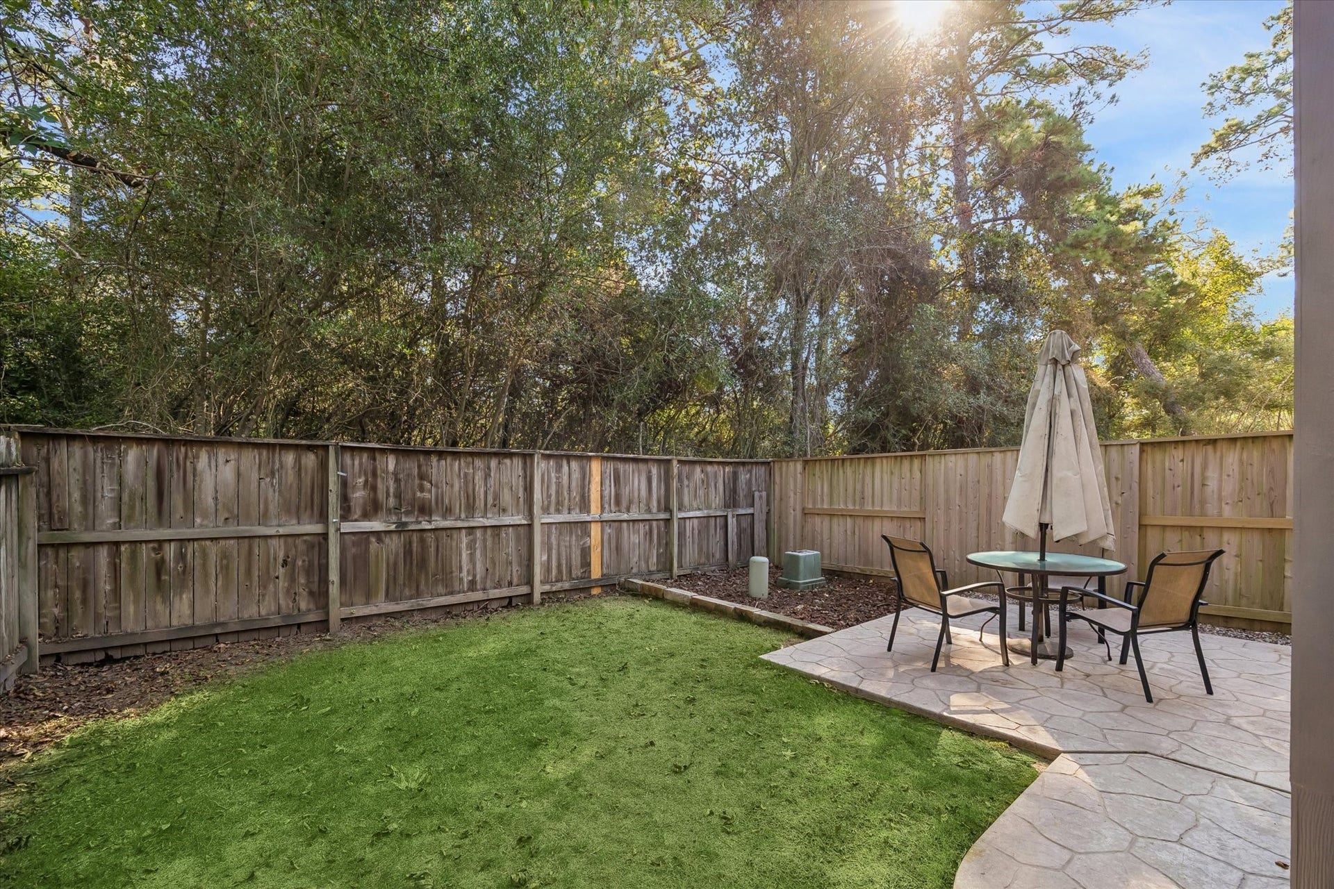 139 Anise Tree Place, Spring, TX 77382 Wonderful green backyard space with extensive patio. Fully fenced.