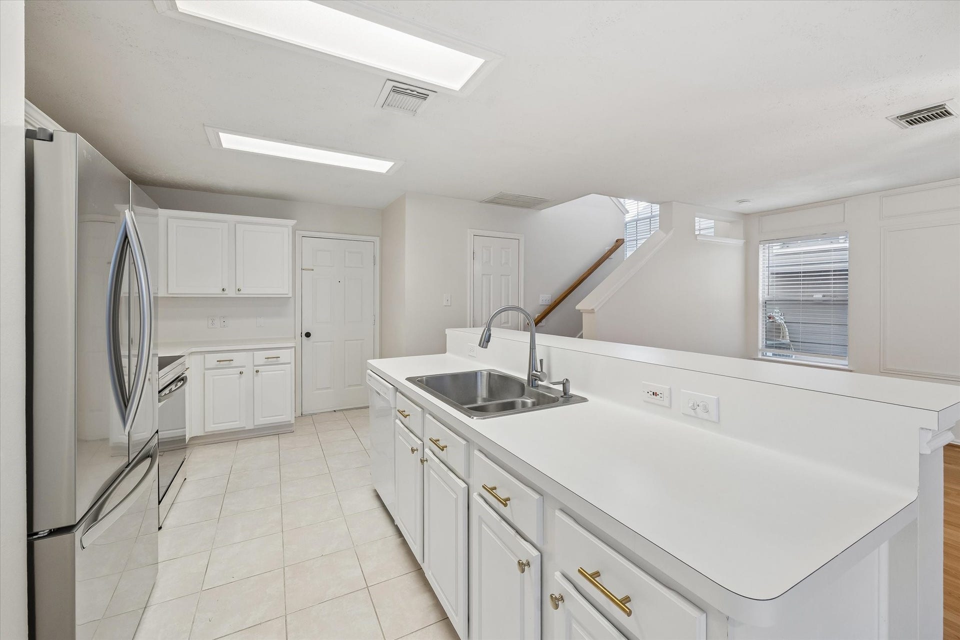139 Anise Tree Place, Spring, TX 77382 Tons of counter space! Easily bring groceries in from the garage. Powder room is door to right by the stairs.