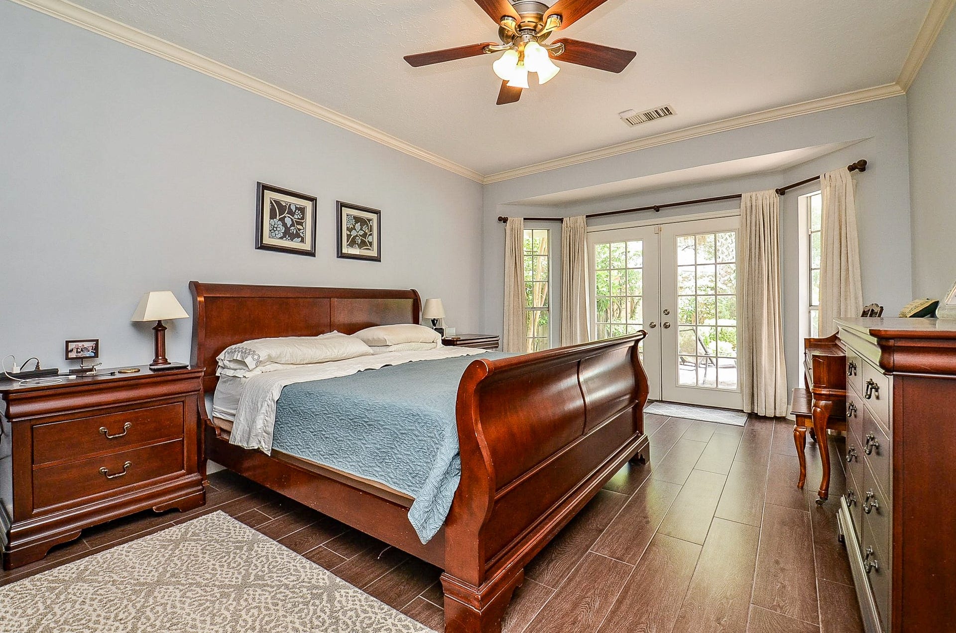 Primary Bedroom with french doors so you can take a dip in the pool right before heading to bed.