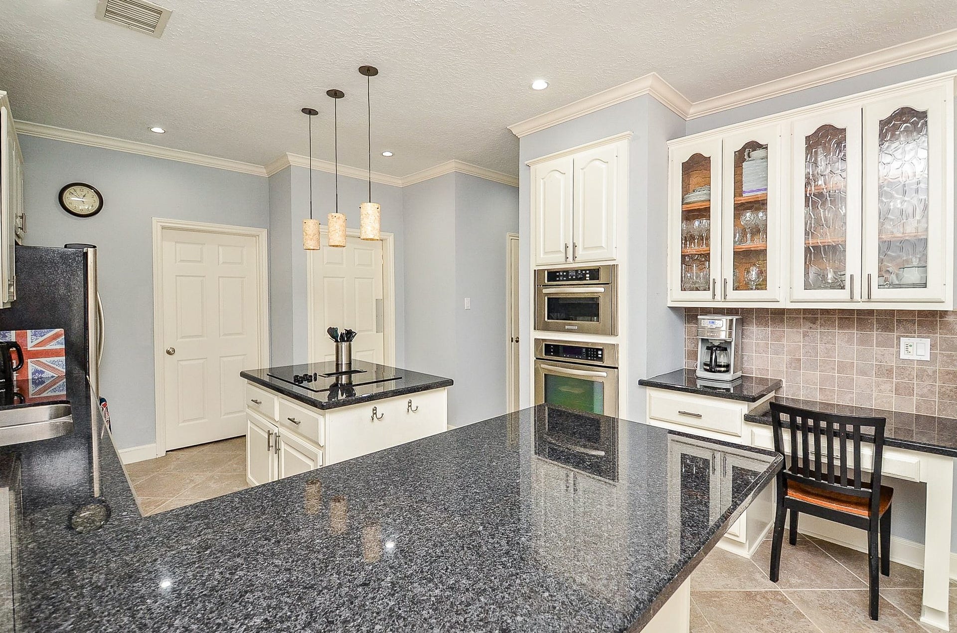 Kitchen Includes Extra Cabinets and Desk Space