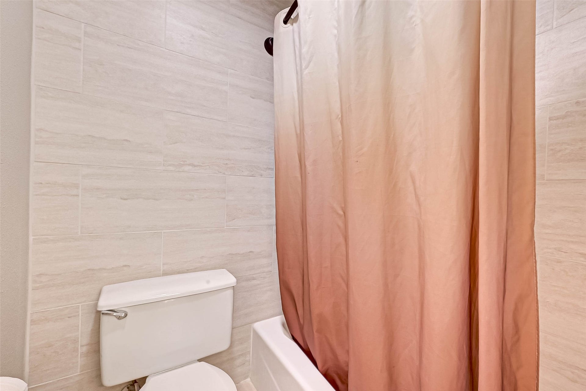 Bathtub/shower in primary bath.
