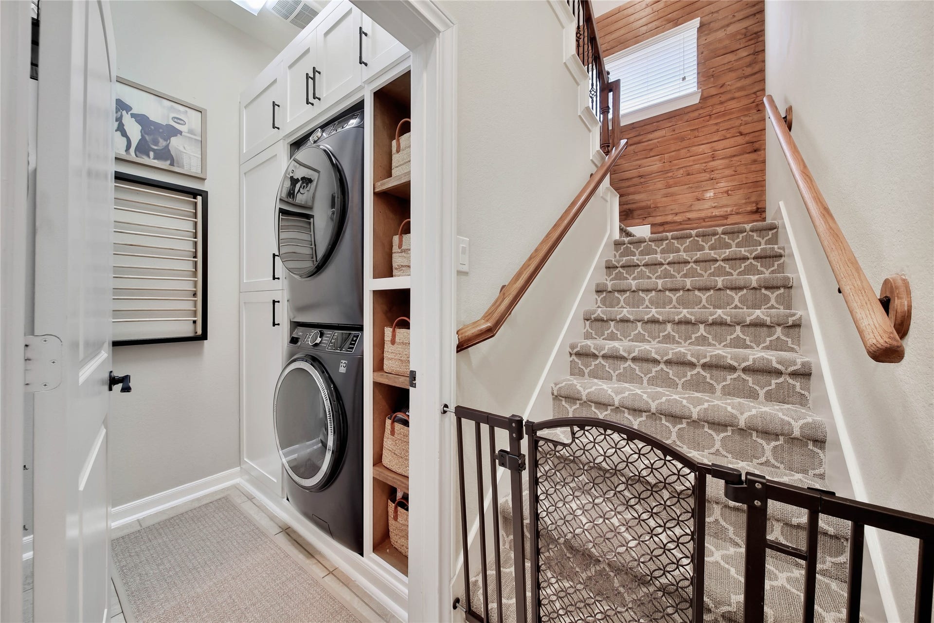 The utility room features custom built-ins, providing exceptional organization and practical storage for everyday needs.