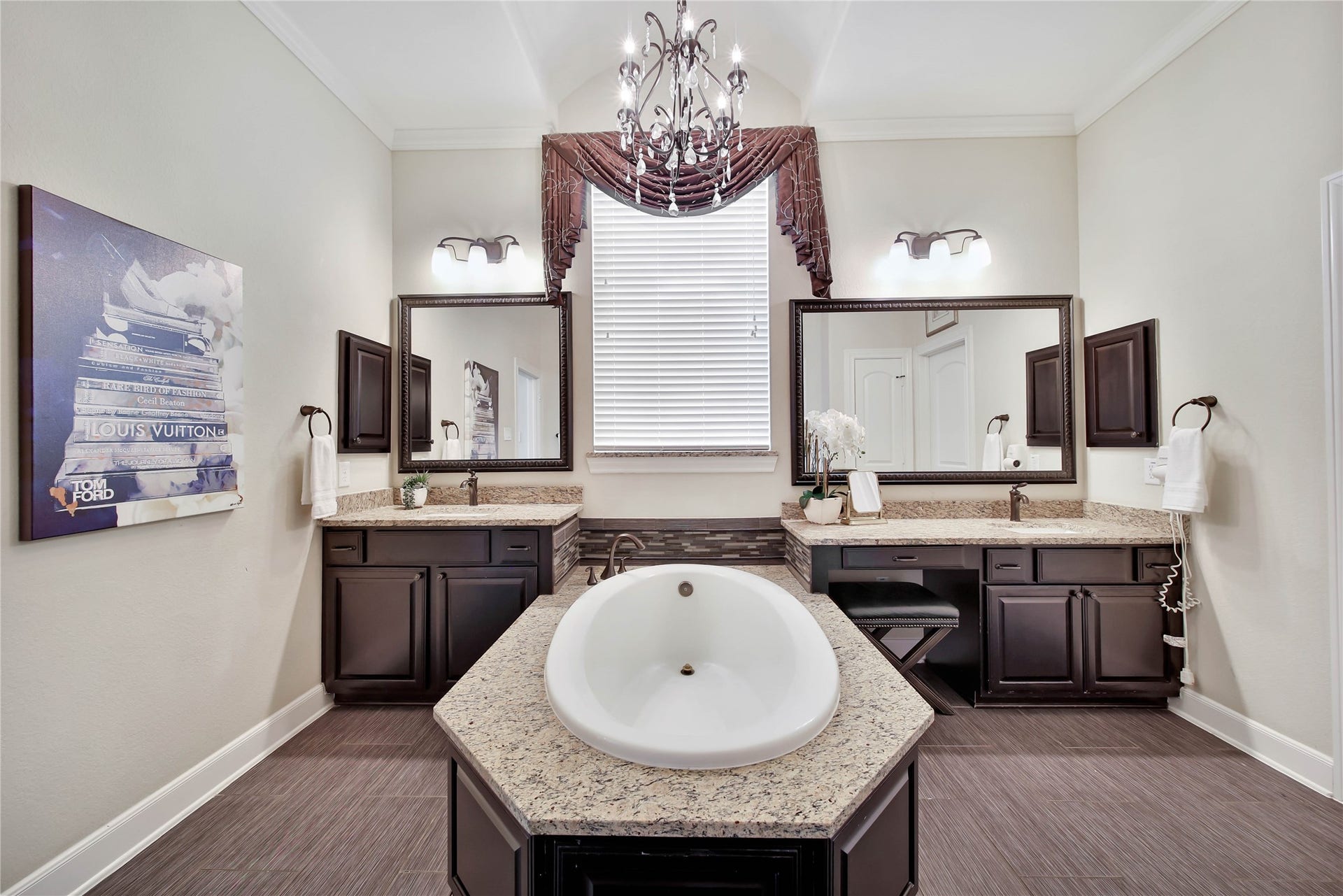 The primary retreat features dual vanities and a soothing soaking tub, creating a spa-like space.