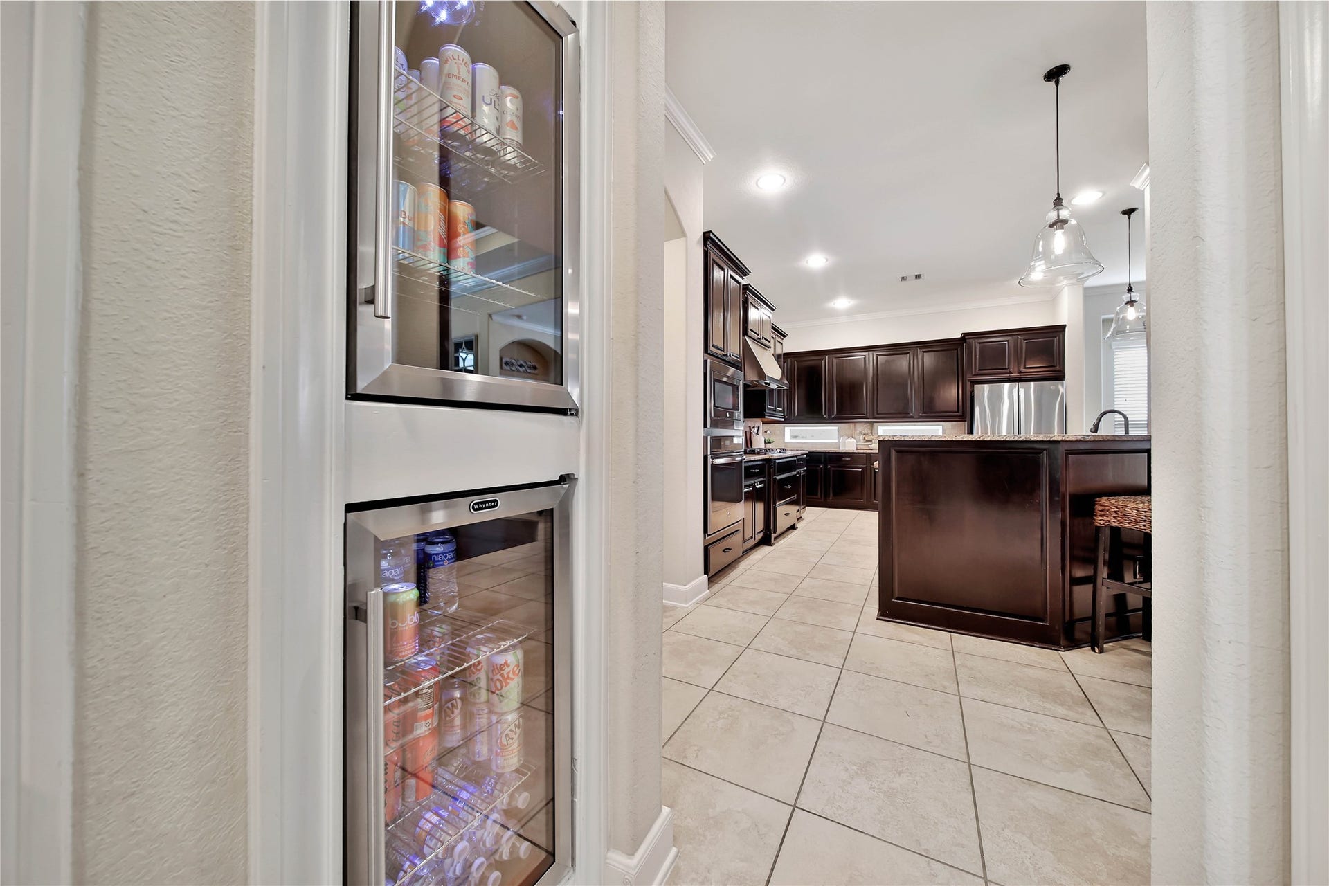 Two beverage refrigerators are a wonderful bonus, providing convenient storage for drinks and making entertaining a breeze.