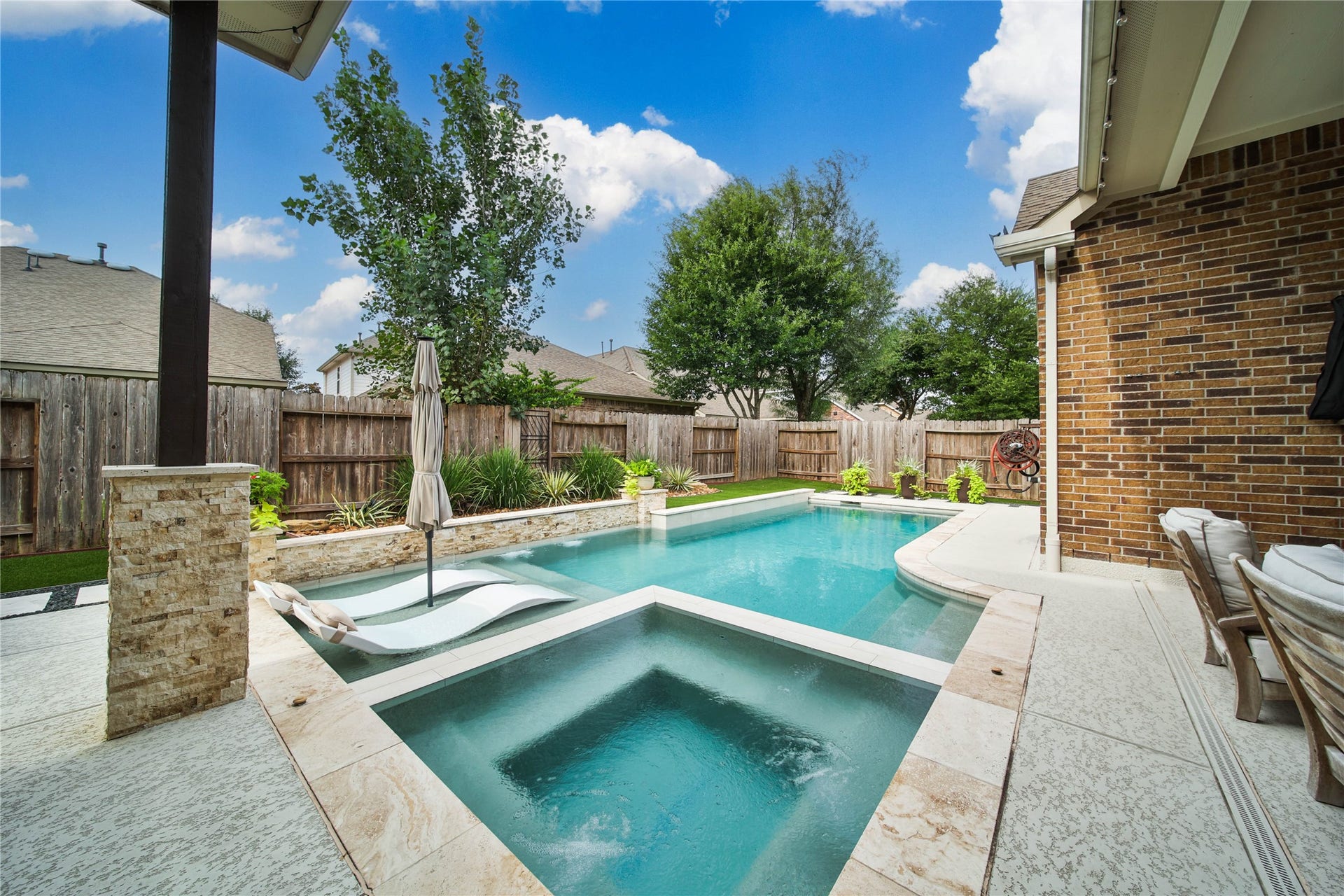 The chlorine pool and spa, built in 2020 by Sunset Pools, provide a beautiful backyard retreat perfect for relaxing, entertaining, and enjoying sunny days at home.