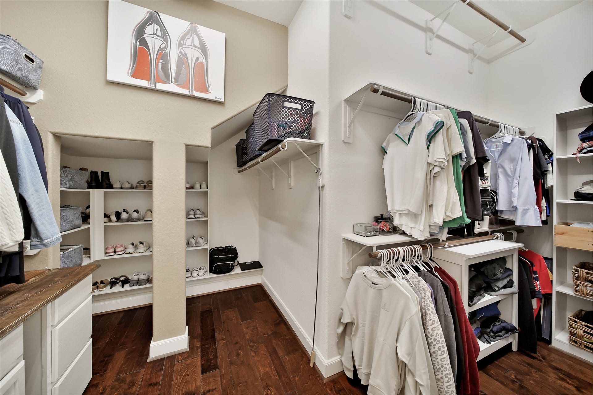 The oversized walk-in closet offers an abundance of space, providing plenty of room to organize, store, and showcase your wardrobe.