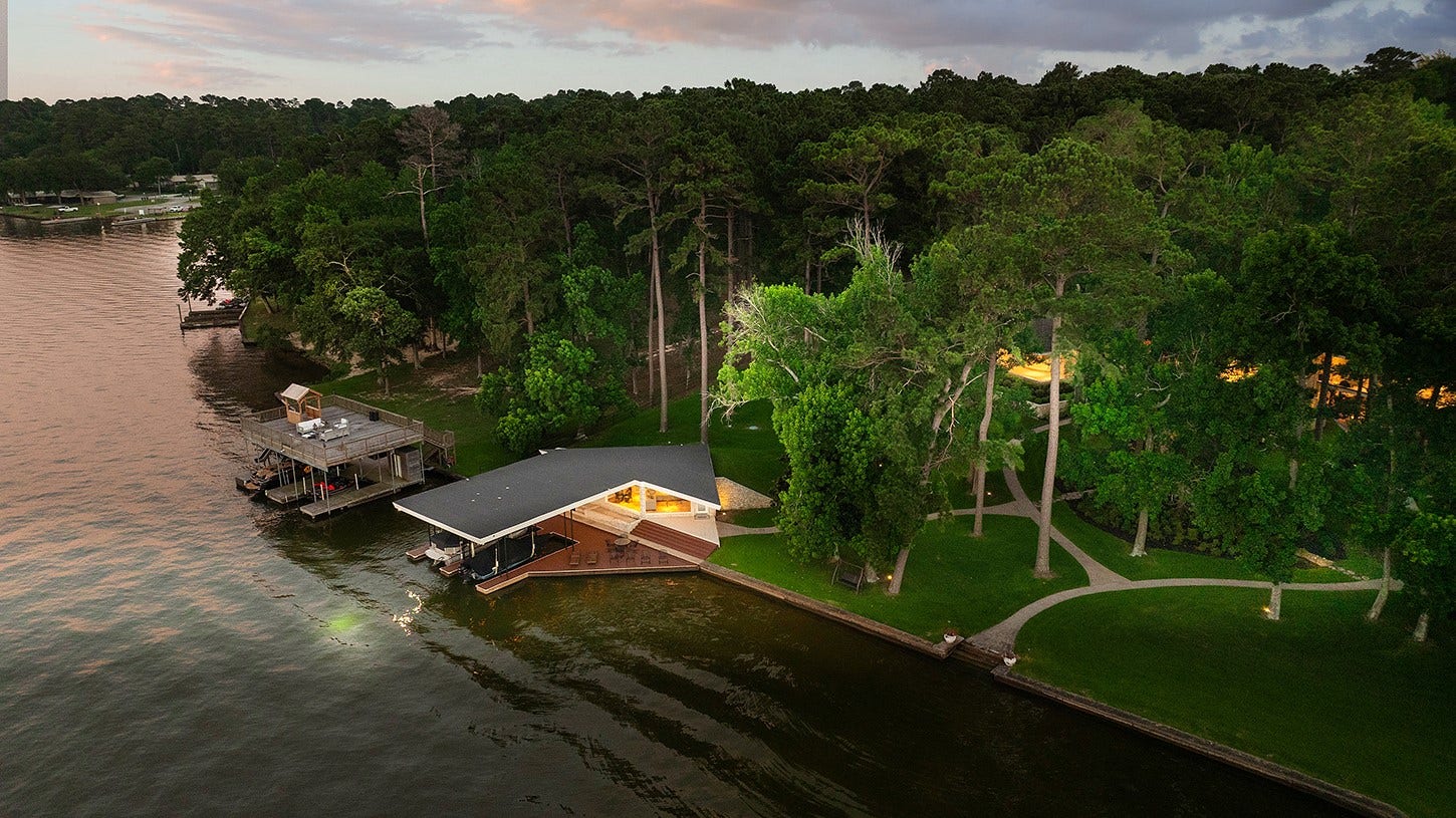 13882 Longwood Drive, Willis, TX 77318 Exceptional waterfront location on Weir Cove with expansive views of Lake Conroe, and breathtaking sunsets!