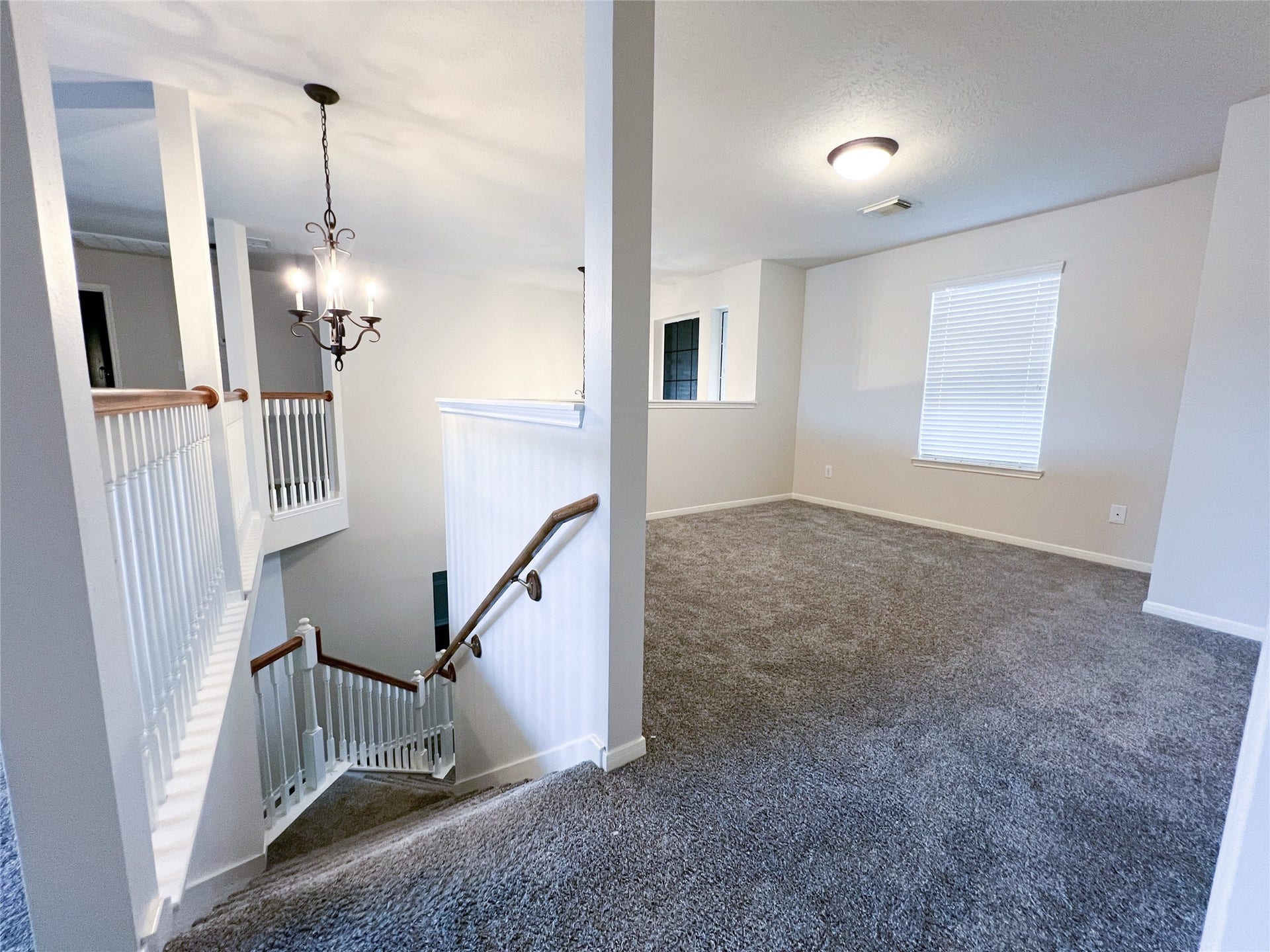 908 Azalea Pointe, League City, TX 77573 Upstairs, enjoy a spacious game room filled with natural light, perfect for entertainment and relaxation.
