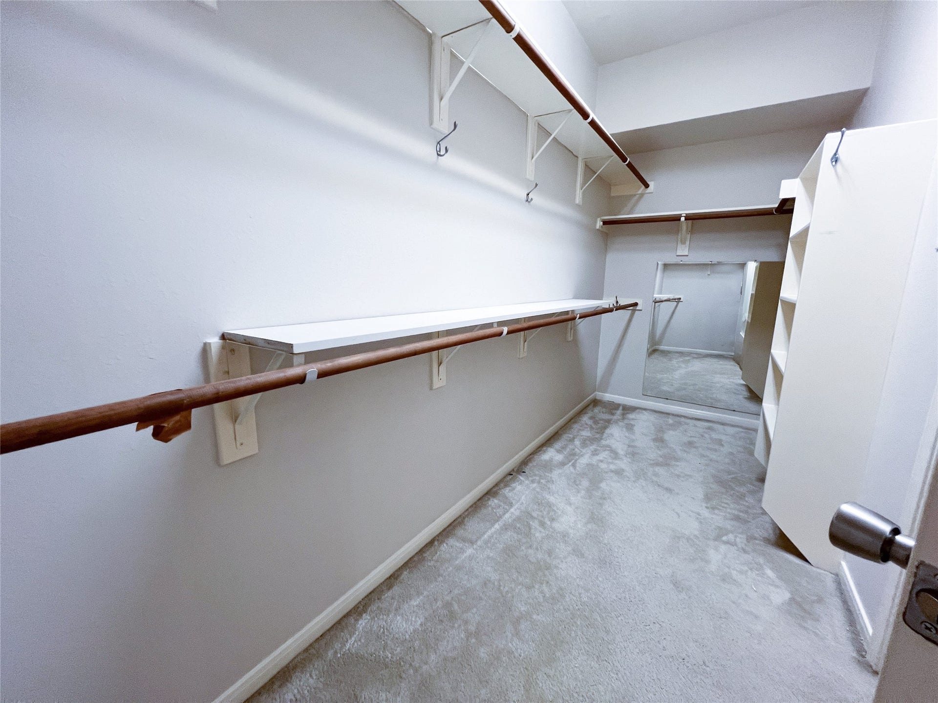908 Azalea Pointe, League City, TX 77573 Experience the convenience and luxury of a spacious primary walk-in closet located on the first floor, designed for optimal organization and style.