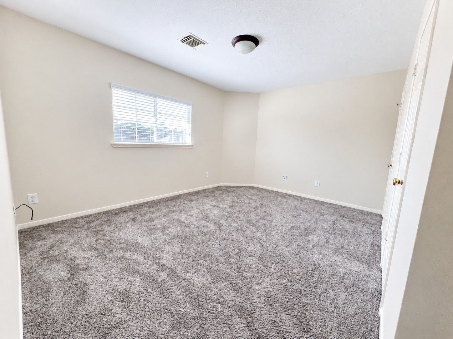 908 Azalea Pointe, League City, TX 77573 Bedroom 5 on the second floor offers a spacious retreat with plush carpeting and abundant natural light, perfect for relaxation.