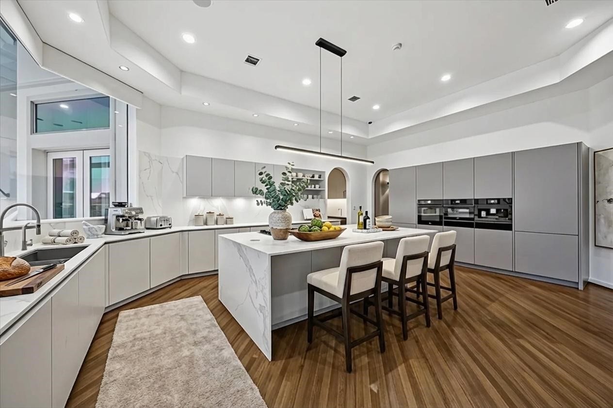 VIRTUALLY STAGED - one idea of how to enjoy cooking and dining in this fine custom 'Cantoni' kitchen, with high-end Miele and Gaggenau built-in appliances - an ideal gathering place for friends and family