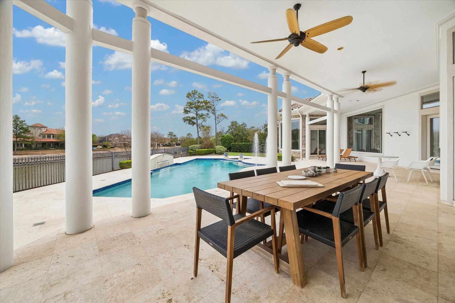 COVERED TERRACES IDEAL FOR ALFRESCO DINING AND ENTERTAINING - with beautiful views throughout the day and evening overlooking the pool/spa, lake and golf course
