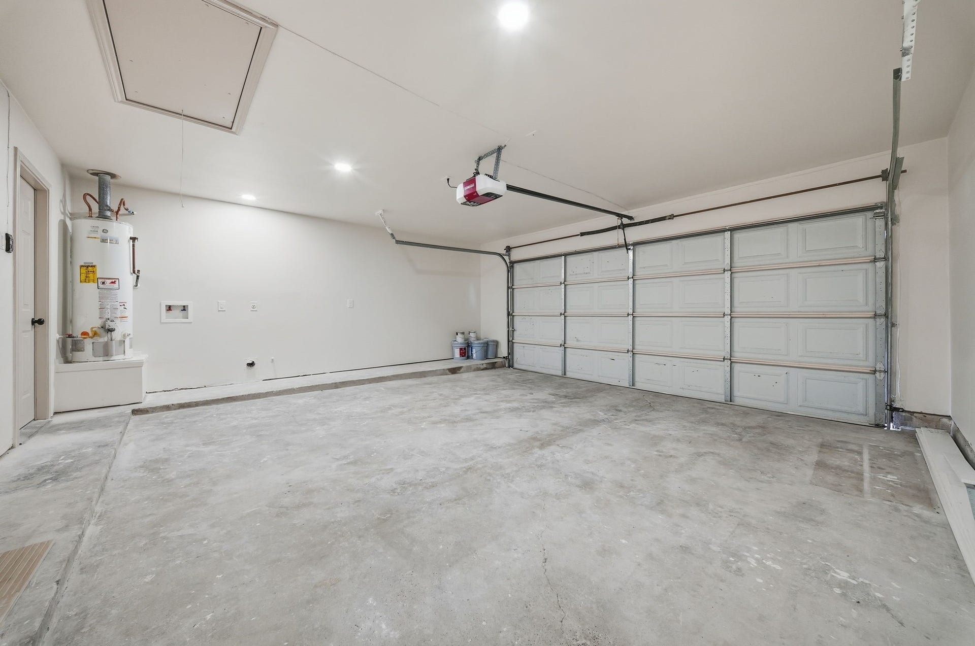 3816 Youpon Drive, La Porte, TX 77571 Spacious two-car garage with ample lighting, perfect for storage or a workshop setup.