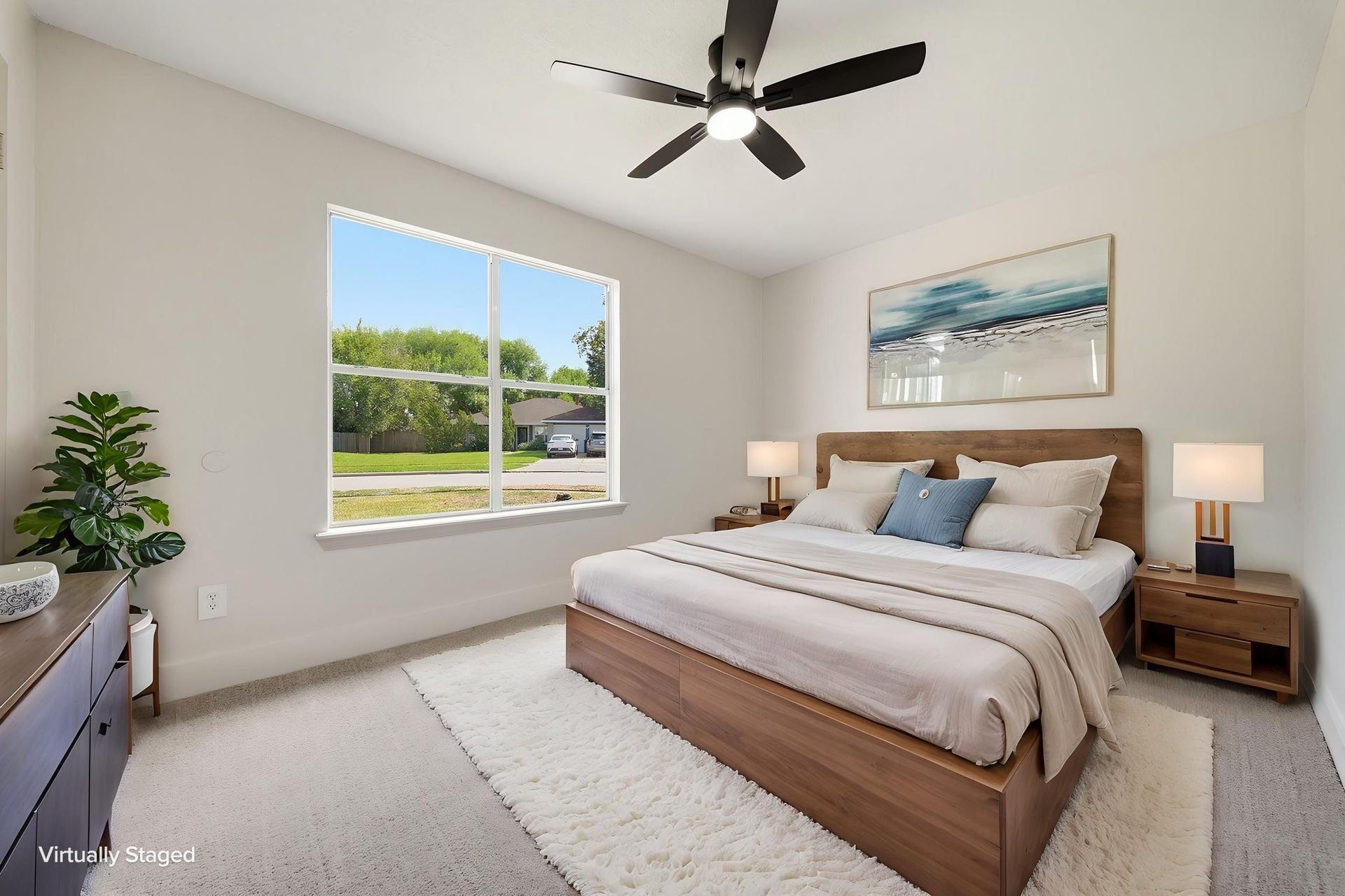3816 Youpon Drive, La Porte, TX 77571 Bright and inviting bedroom with a large window offering plenty of natural light, plush carpeting, a stylish ceiling fan for a cozy atmosphere.