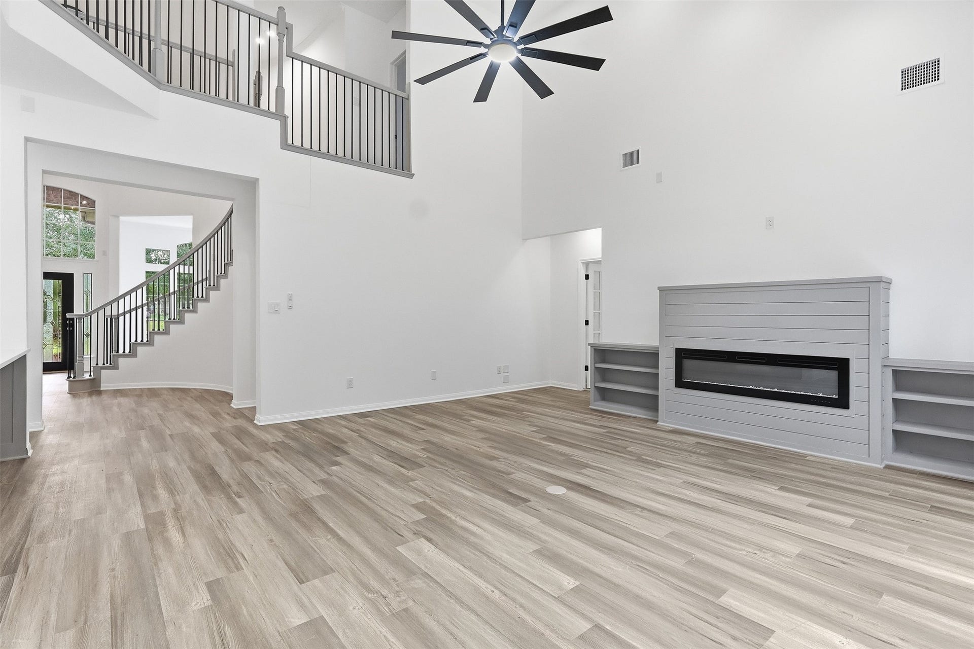 Upstairs catwalk provides a striking overlook into the living area below.