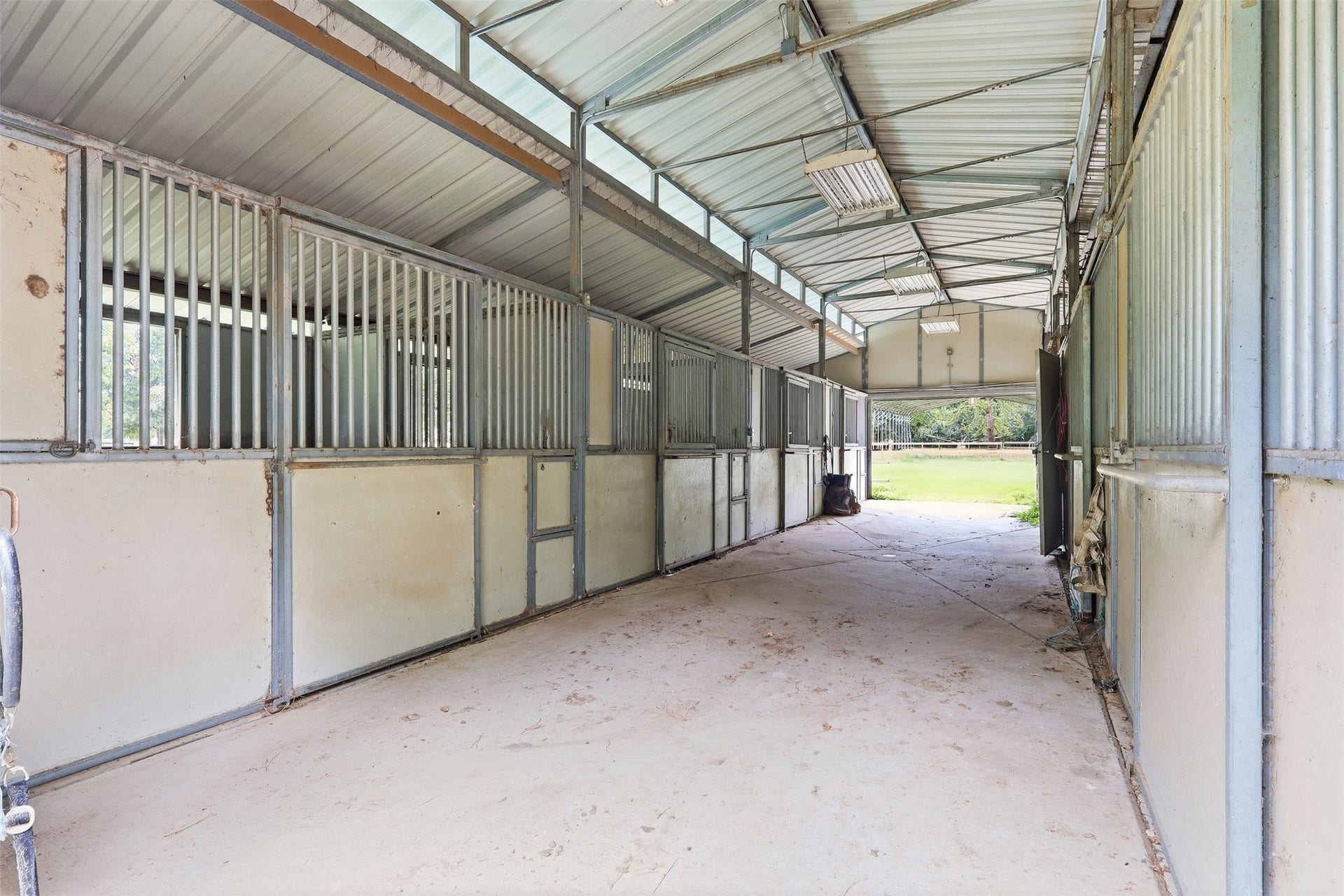 Step inside the 8-stall barn. It could use a bit of TLC, but still very functional.