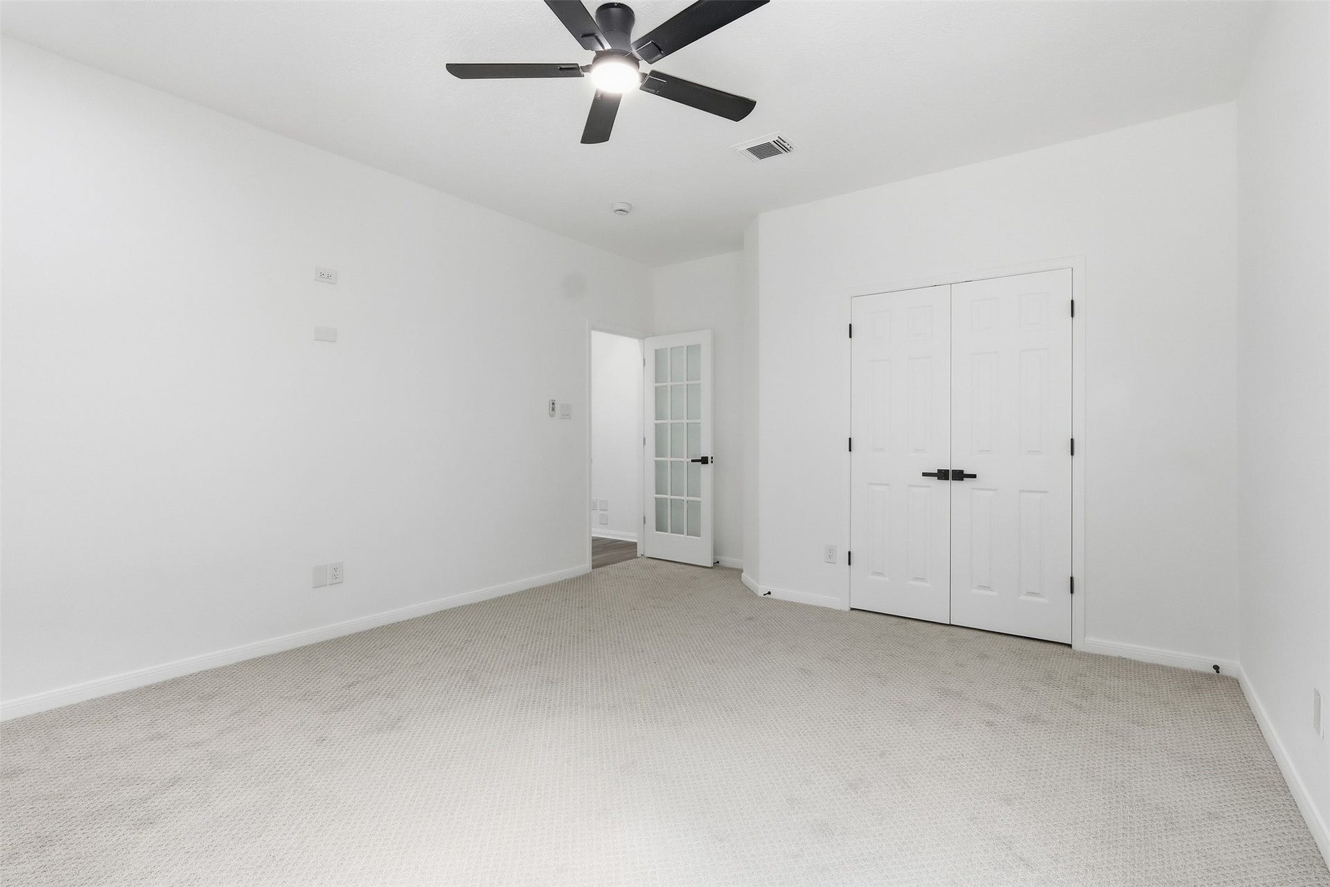 Another view of the 2nd bedroom downstairs. This room  would make a great home office or home gym.
