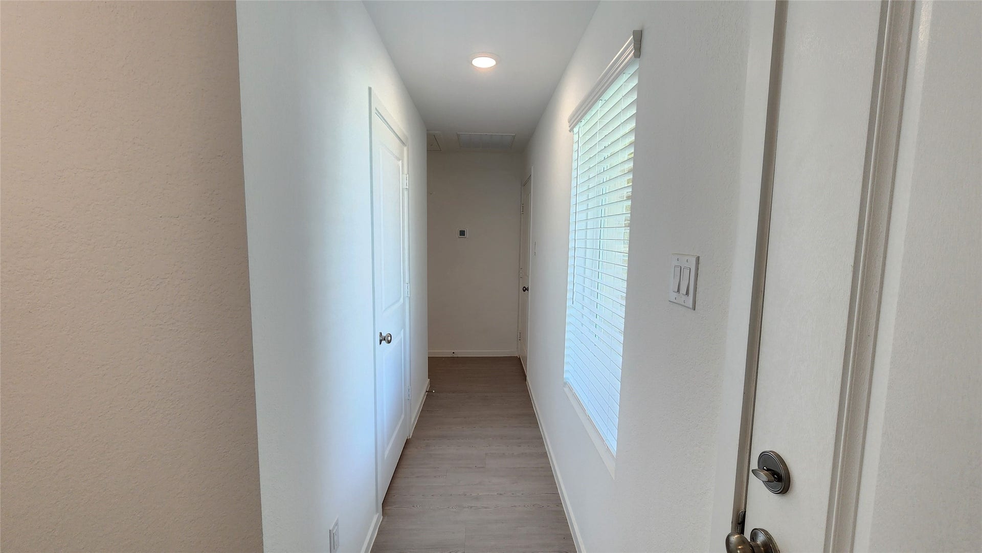 6303 Geyser Starish Drive, Katy, TX 77493 Hall to laundry room leading to 2 additonal bedrooms and hallway bathroom
