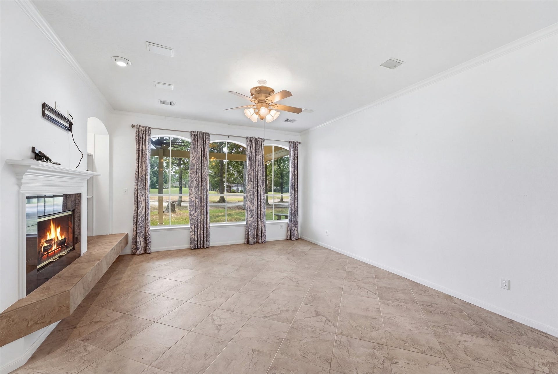 Looking from the kitchen through the family room to view the golf course.