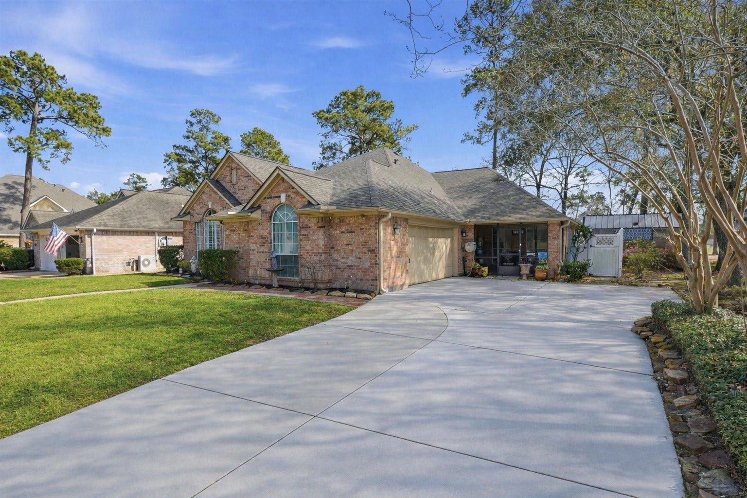 Charming brick home with a two-car garage, nestled in a landscaped yard with mature trees. The driveway offers ample parking, and the front garden enhances curb appeal. Ideal for those seeking a cozy, inviting property in a serene neighborhood.