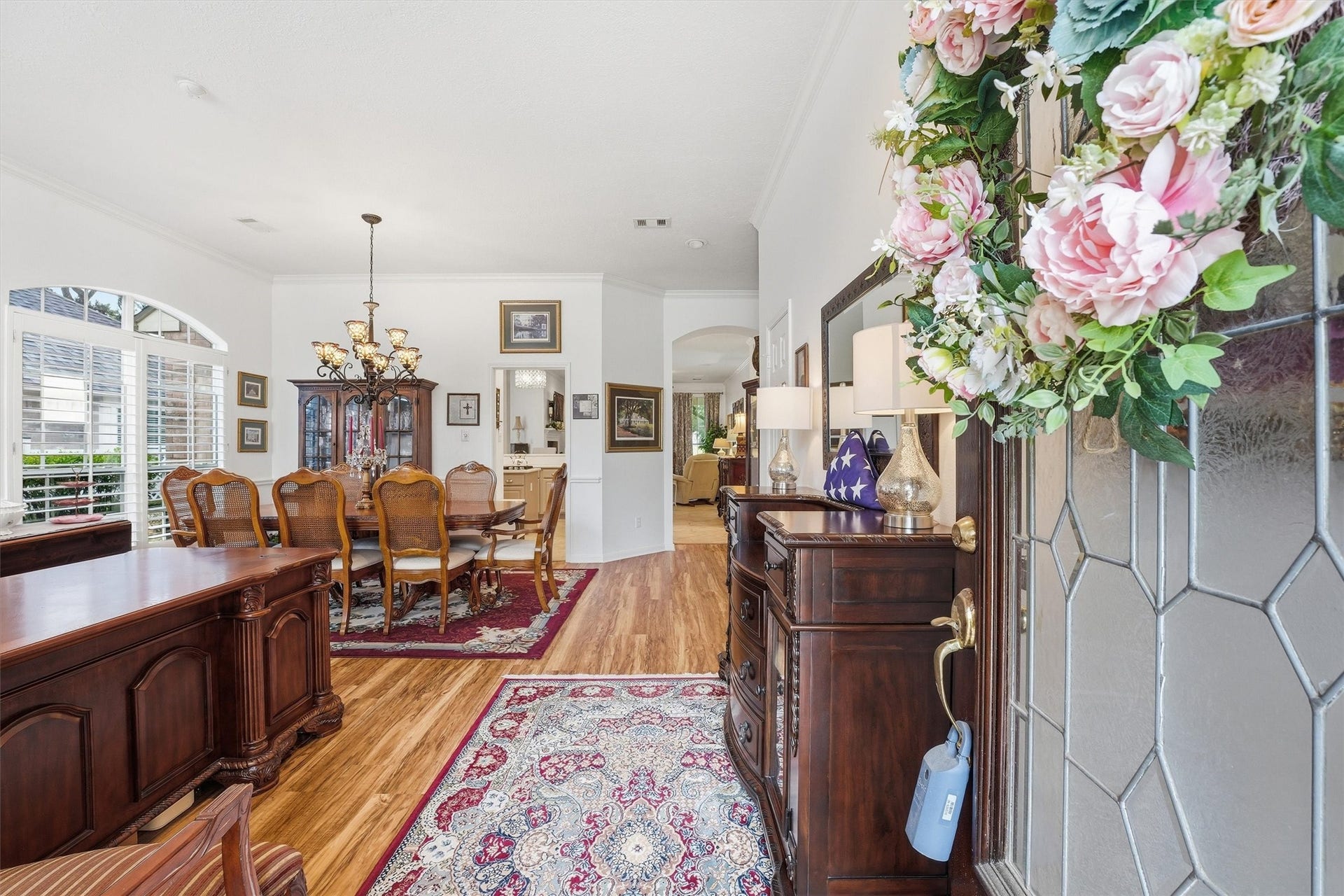 This is a large room when you enter the home presently divided between home office and dining room.