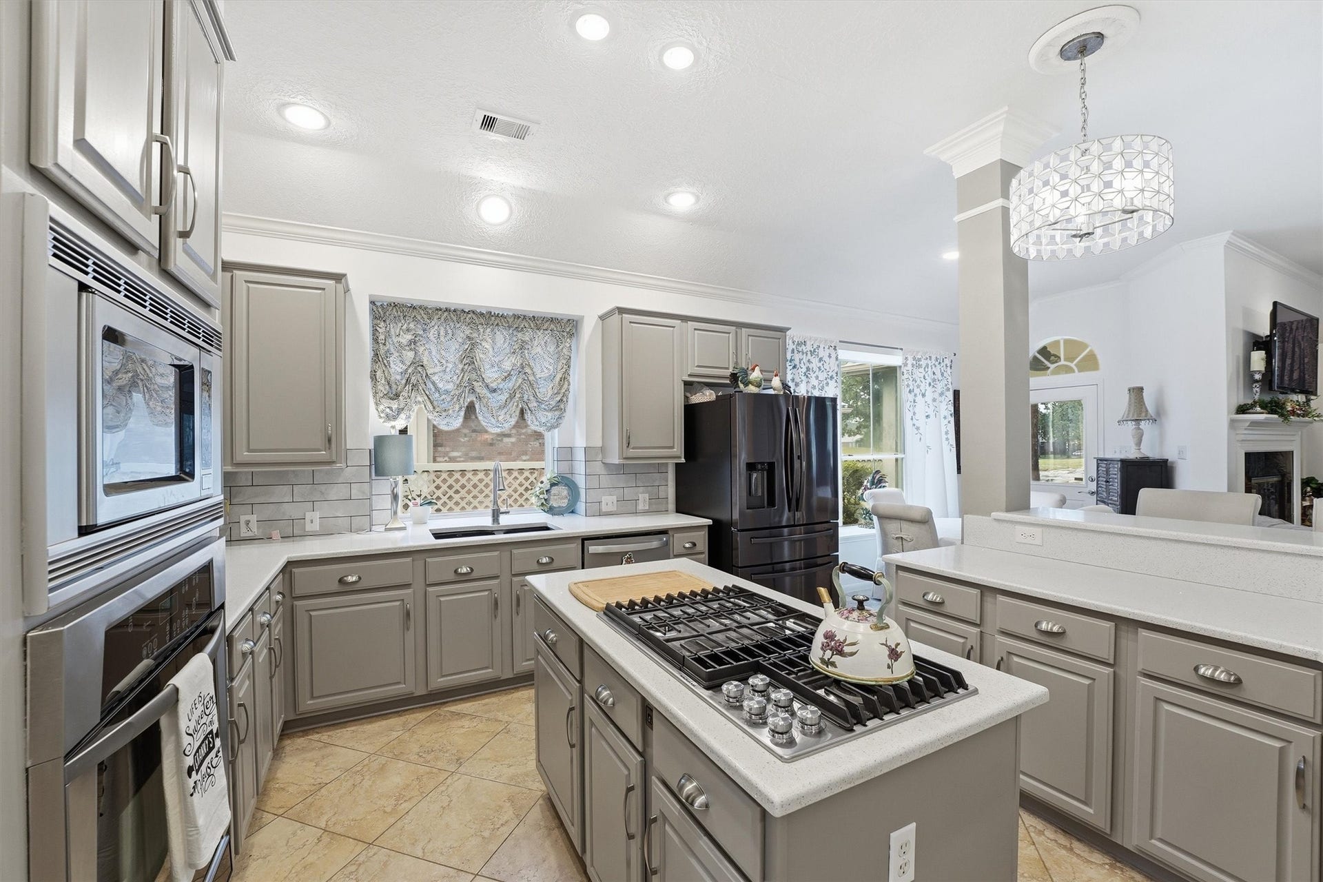 The kitchen is a chef's delight.  It is light and airy, beautiful countertops, gas cooktop and open to the family room.