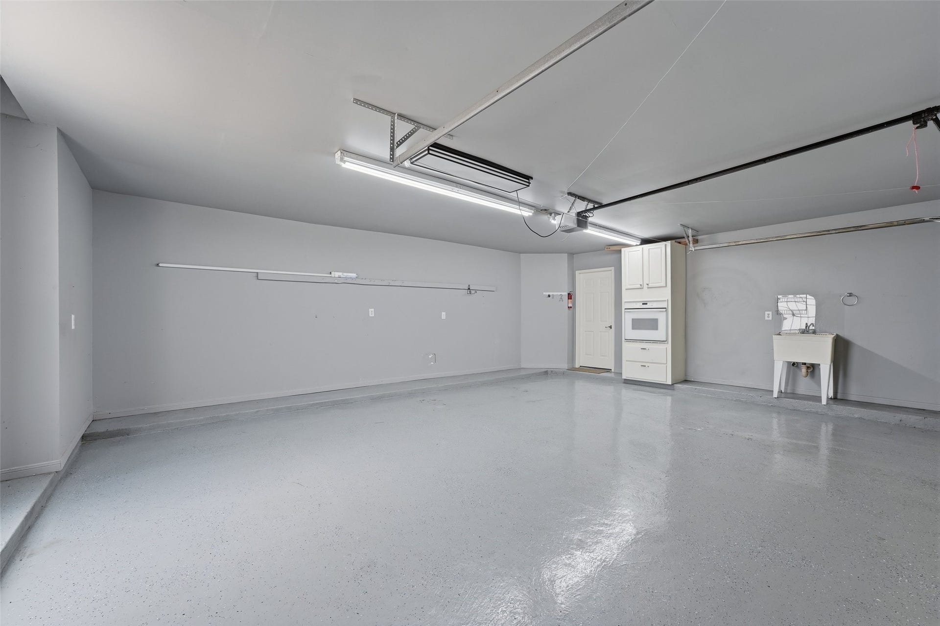 Garage with room for your golf cart and 2 cars.