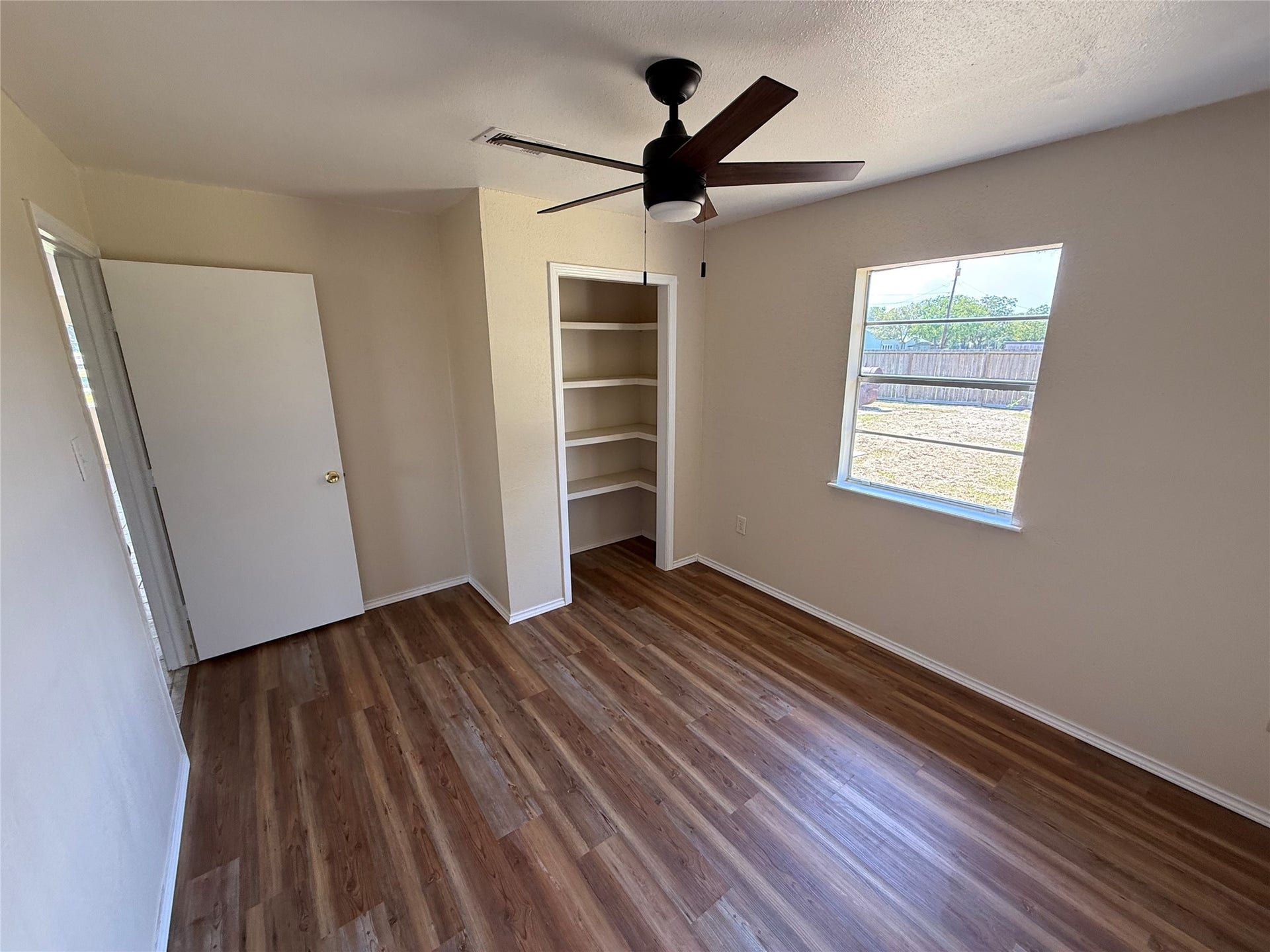 2524 Shouse Road, Santa Fe, TX 77510 Alternate room view highlighting closet storage and open shelving.