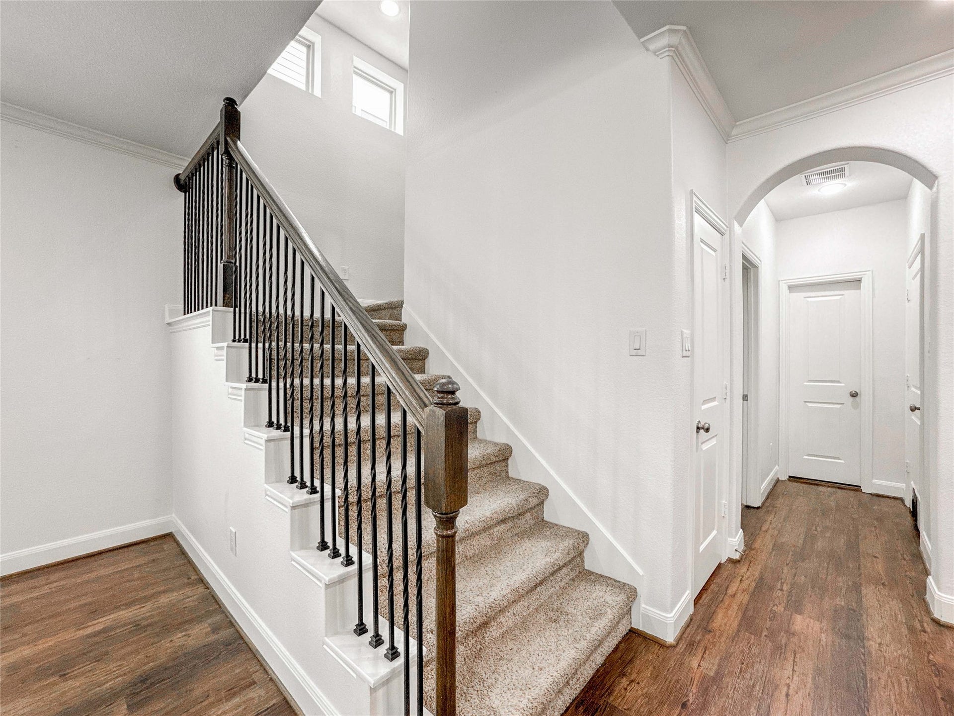 Ascend the carpeted staircase to the second floor, where you'll find three spacious bedrooms in addition to the luxurious primary suite.