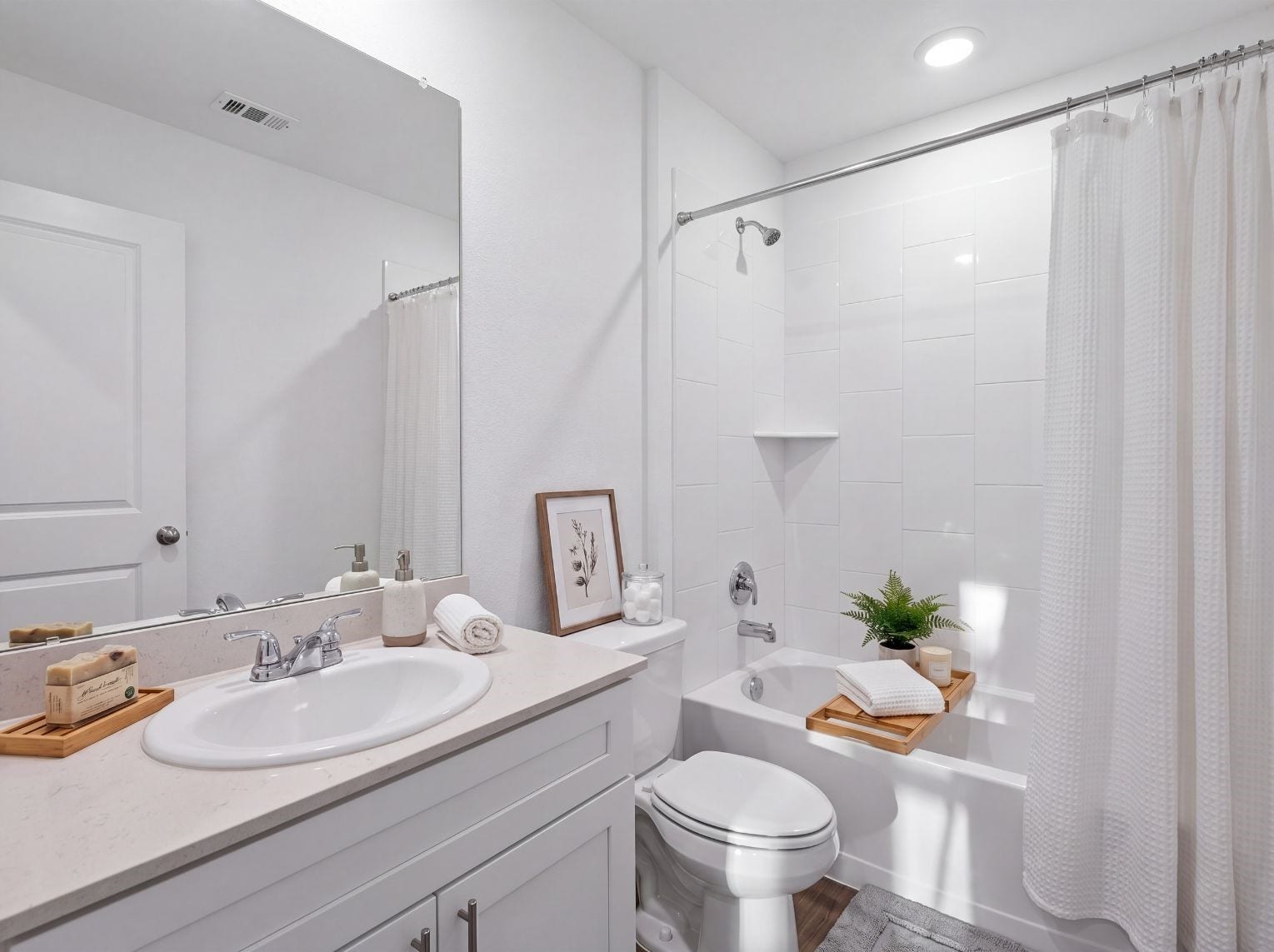 10816 N Baron Village Drive, Conroe, TX 77306 Full bath with a single-sink vanity, light stone counter, large mirror, and a tub-and-shower combo with a tall tile surround. Recessed lighting and a built-in corner shelf add function.
This photo has been digitally staged to illustrate the possibilities of the home's aesthetic and potential design. Some furnishings and dcor shown are for visual inspiration.