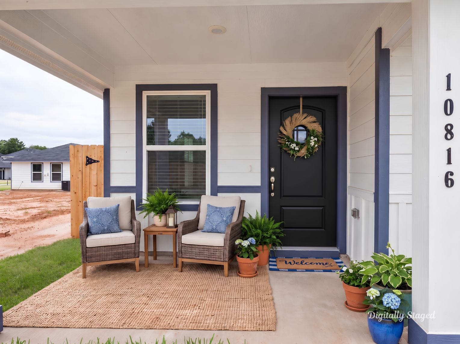 10816 N Baron Village Drive, Conroe, TX 77306 Covered front porch with a wood-tone front door, navy trim accents, and room to sit and relax. A welcoming spot at the home's entry.
This photo has been digitally staged to illustrate the possibilities of the home's aesthetic and potential design. Some furnishings and dcor shown are for visual inspiration.