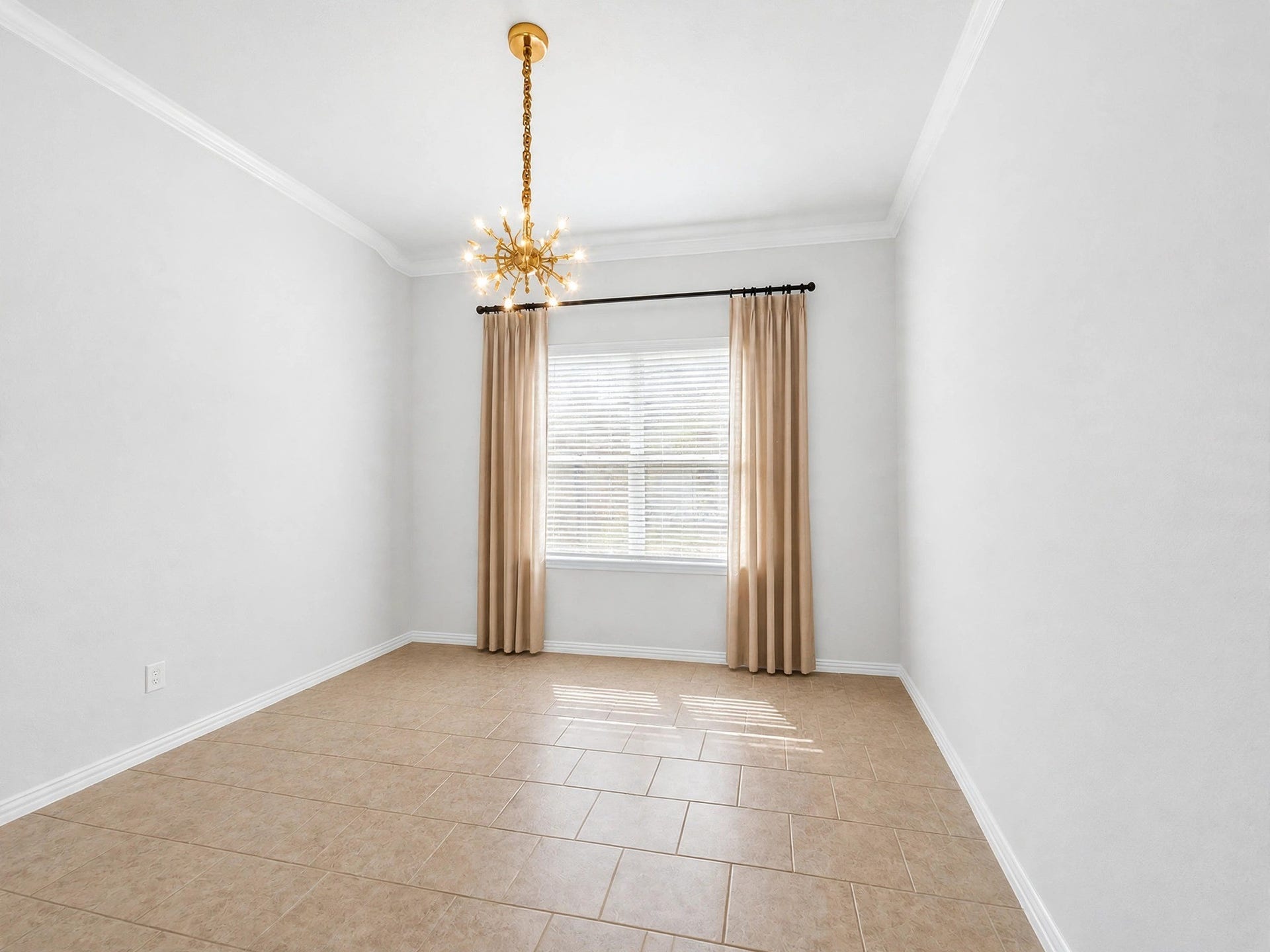 1902 Willow Ridge Lane, Fulshear, TX 77423 Dining area with a decorative chandelier, tile flooring, and a large window.