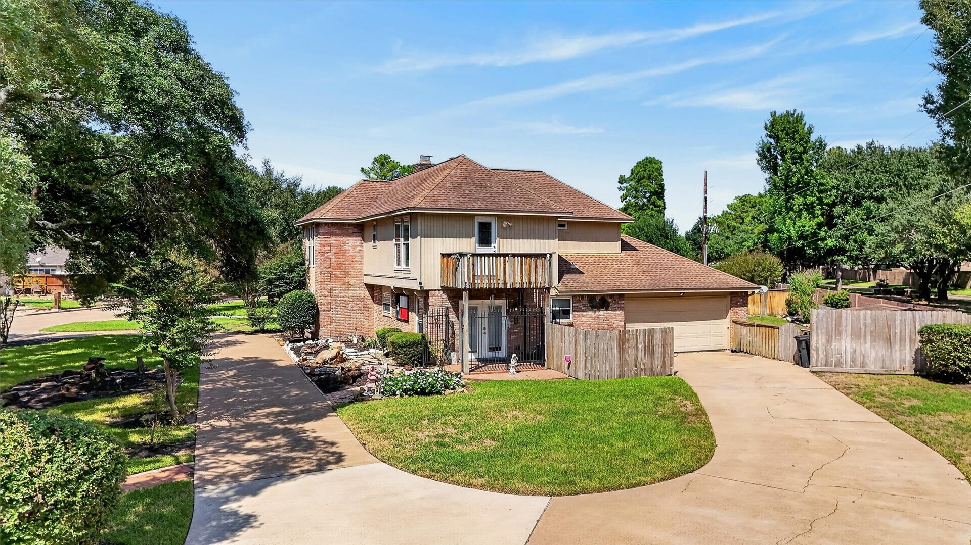Circular driveway, driveway to garage. Side door to kitchen and balcony off primary bedroom